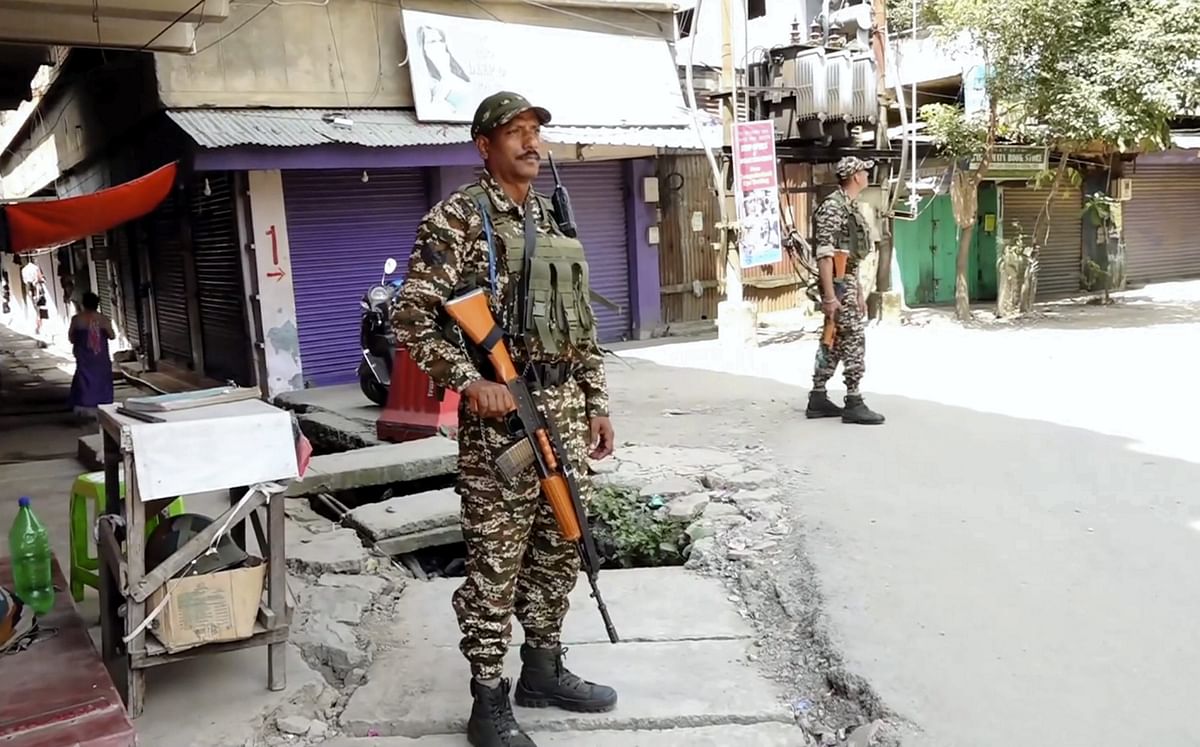 **EDS: SCREENSHOT VIA PTI VIDEOS** Imphal: Security personnel stand guard after a fresh violence in Imphal Sunday Sept. 8 2024. (PTI Photo) (PTI09_08_2024_000045B)