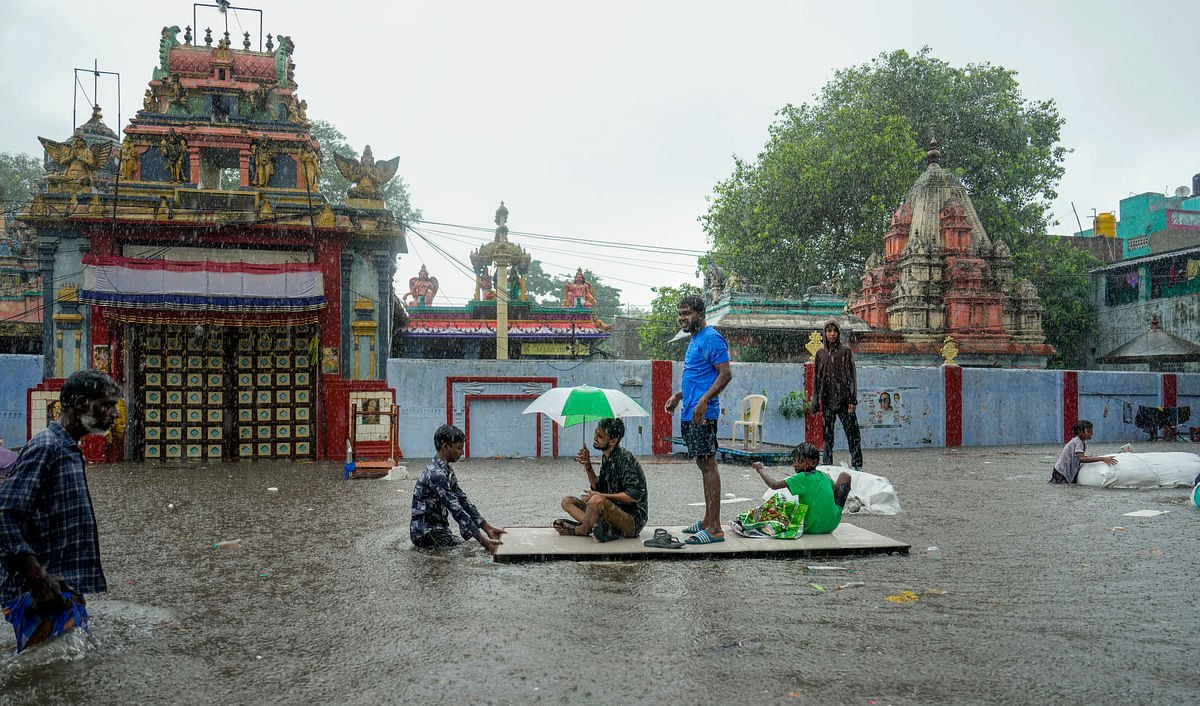 Chennai: People use a makeshift boat to travel at a waterlogged area amid rain at Pattalam in Chennai Tuesday Oct. 15 2024. (PTI Photo/R Senthilkumar)(PTI10_15_2024_000165B)