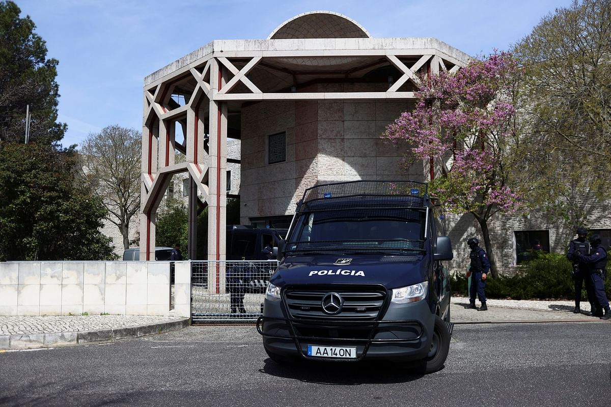 A view of a police vehicle outside Ismaili Centre, after a deadly knife attack in Lisbon, Portugal, March 28, 2023. REUTERS/Pedro Nunes