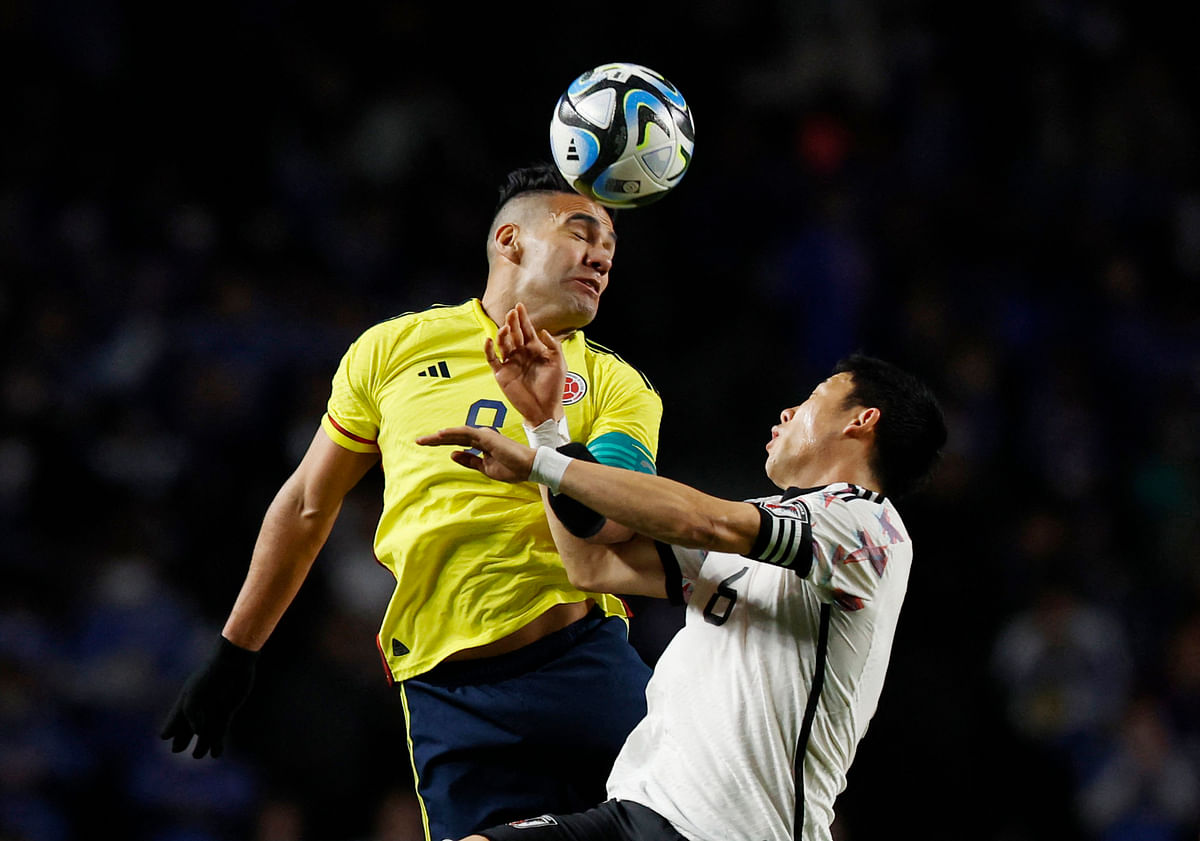 Soccer Football - International Friendly - Japan v Colombia - Yodoko Sakura Stadium, Osaka, Japan - March 28, 2023 Colombia's Radamel Falcao in action with Japan's Wataru Endo REUTERS/Issei Kato