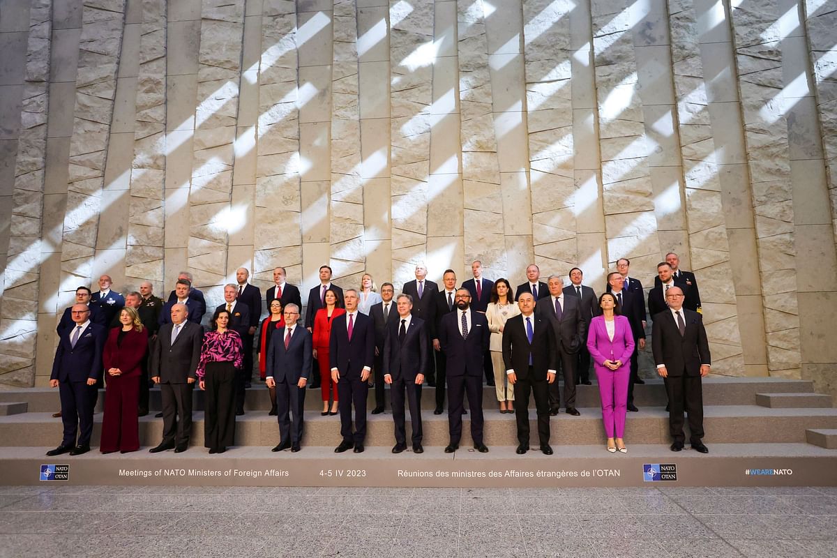 NATO Secretary General Jens Stoltenberg and and NATO defence ministers pose for a family photo during a NATO foreign ministers' meeting at the Alliance's headquarters in Brussels, Belgium April 5, 2023. REUTERS/Johanna Geron