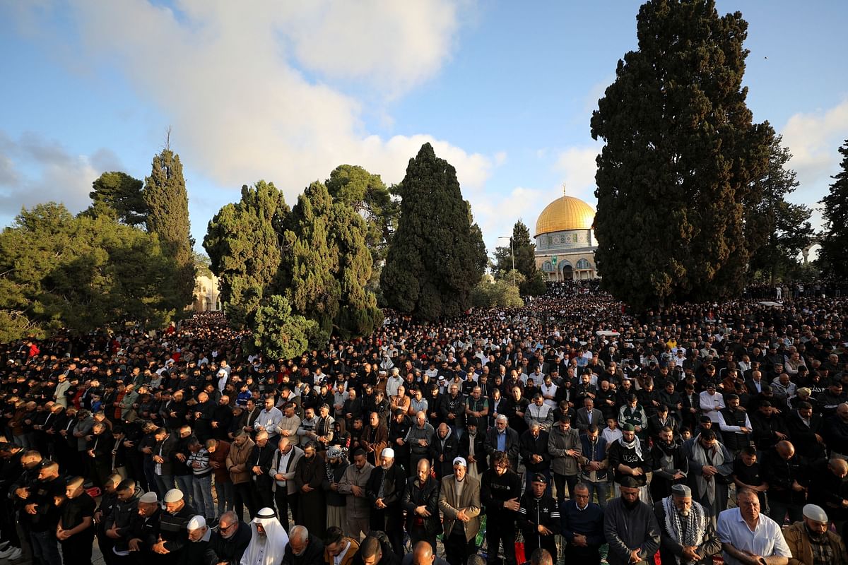 Palestinians attend Eid al-Fitr prayers at the compound that houses al-Aqsa mosque, known to Muslims as Noble Sanctuary and to Jews as Temple Mount in Jerusalem's Old City, April 21, 2023. REUTERS/Jamal Awad NO RESALES. NO ARCHIVES