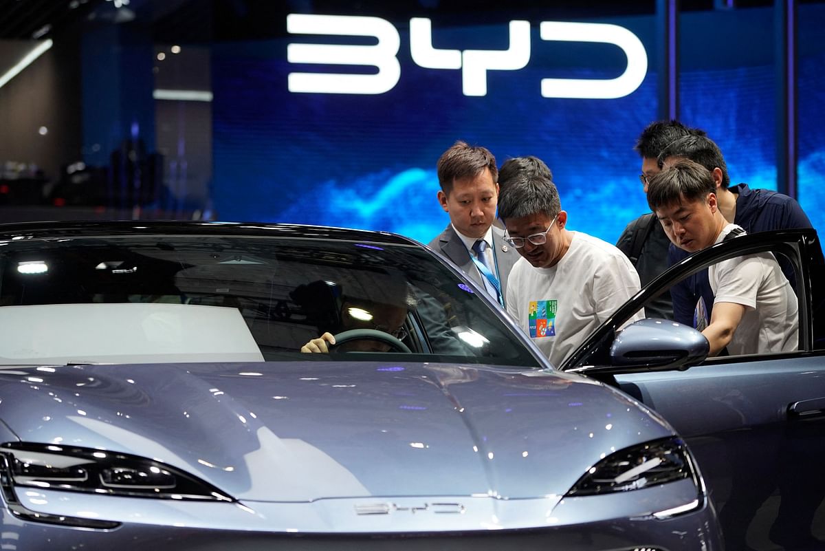 Visitors look at a BYD Seal electric vehicle at the Auto Shanghai show, in Shanghai, China April 18, 2023. REUTERS/Aly Song