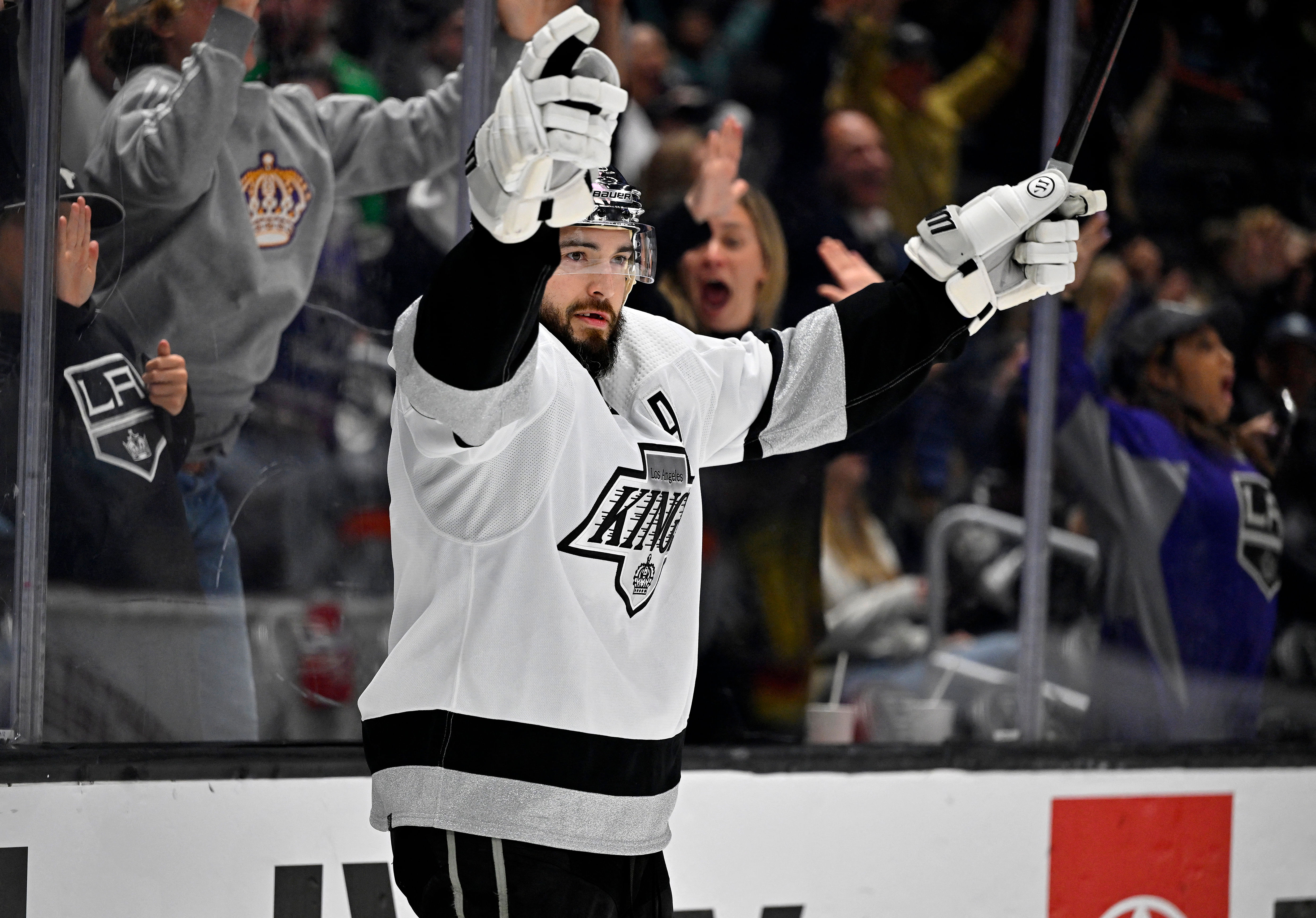 Apr 10, 2023; Los Angeles, California, USA;  Los Angeles Kings defenseman Drew Doughty  smiles after scoring an empty net goal from the opposite end of the ice in the third period against the Vancouver Canucks at Crypto.com Arena. Mandatory Credit: Jayne Kamin-Oncea-USA TODAY Sports