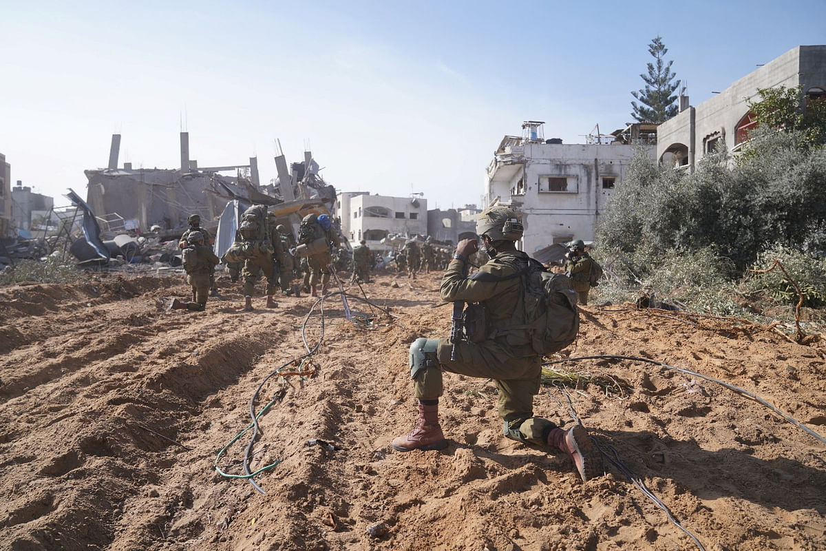 An Israeli soldier operates in the Gaza Strip, amid the ongoing conflict between Israel and the Palestinian Islamist group Hamas, in this handout picture released on December 19, 2023.     Israel Defense Forces/Handout via REUTERS    THIS IMAGE HAS BEEN SUPPLIED BY A THIRD PARTY