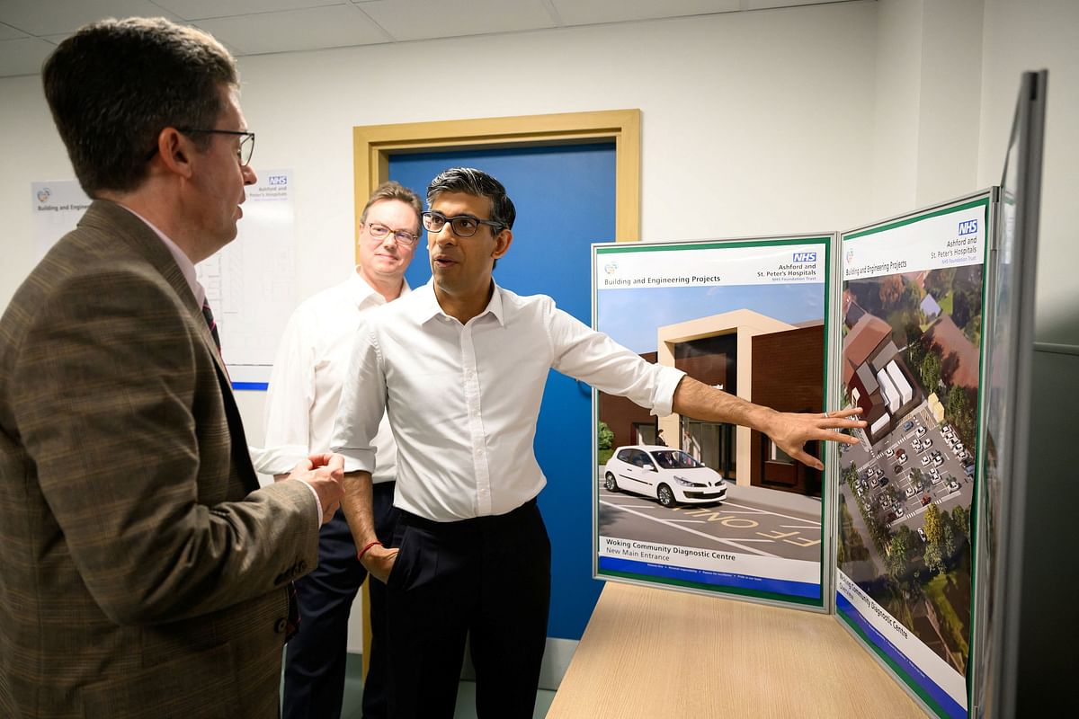 Britain's Prime Minister Rishi Sunak is shown re-development plans by Project Director Stephen Hepworth during a visit to Woking Community Hospital on April 11, 2024 in Woking, Britain. Leon Neal/Pool via REUTERS