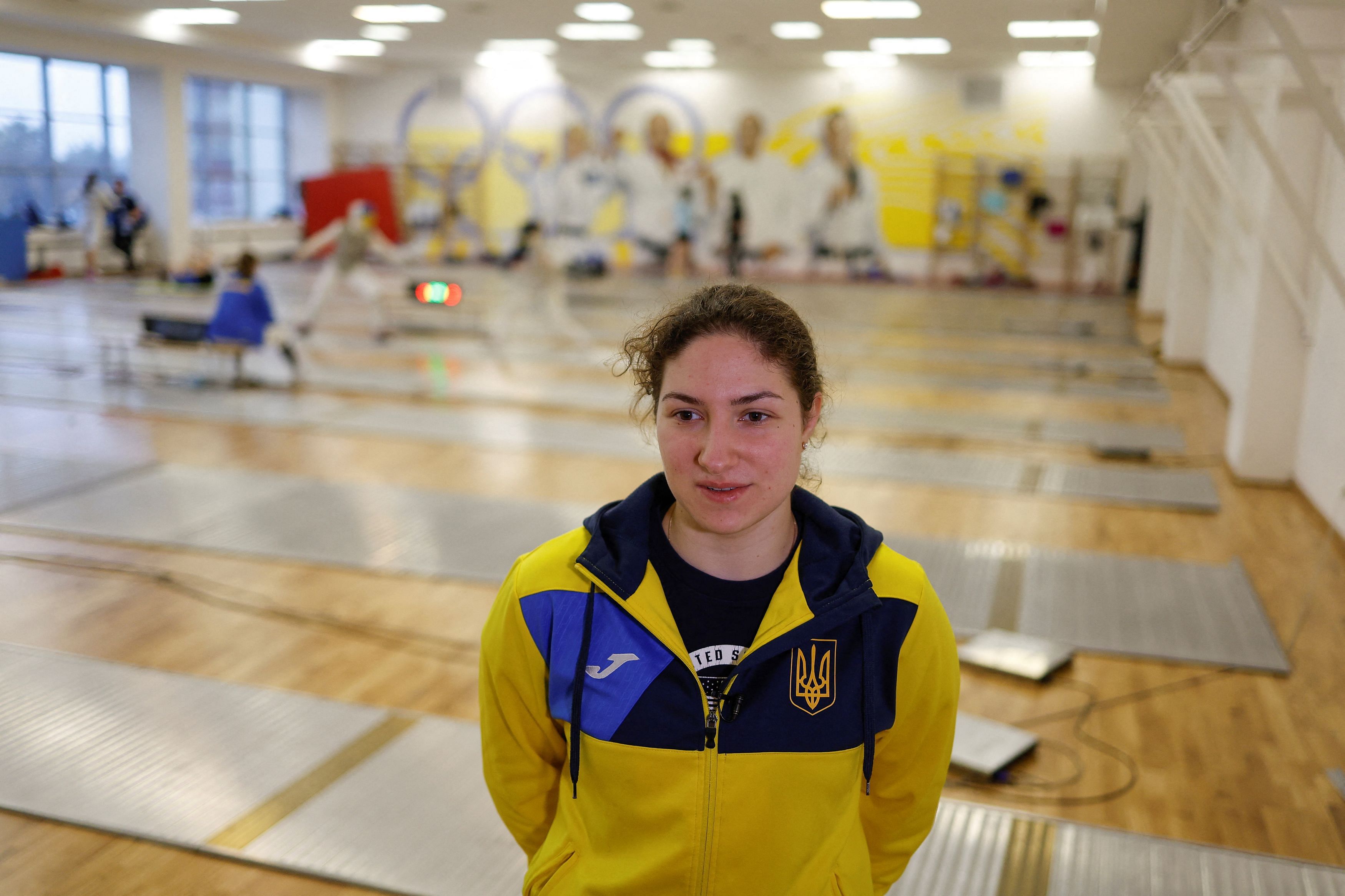 Member of Ukraine's fencing team Olha Sopit speaks to Reuters journalist after a training session at the Olympic training base, amid Russia's attack on Ukraine, in Kyiv, Ukraine March 28, 2023. REUTERS/Valentyn Ogirenko