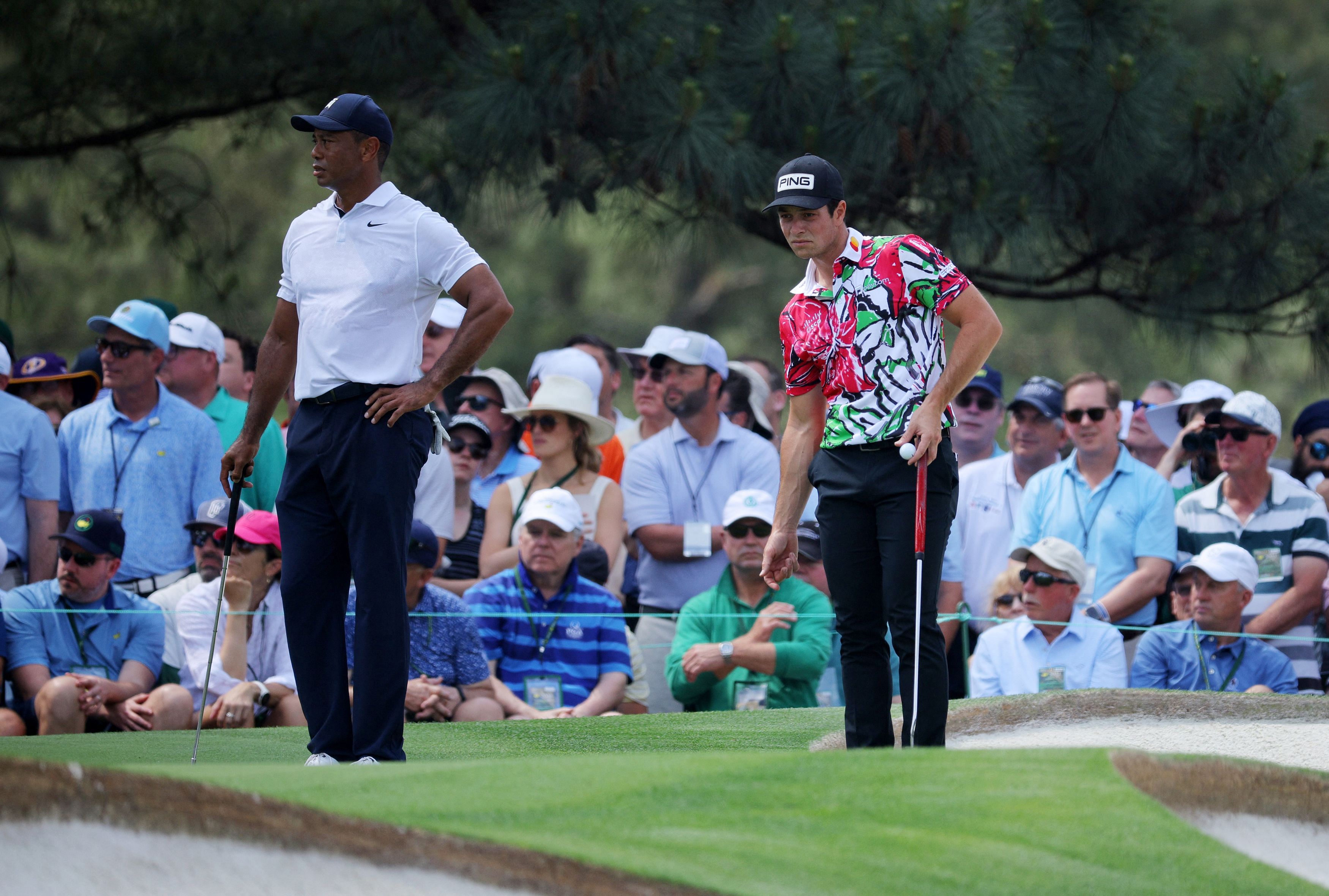 Golf - The Masters - Augusta National Golf Club - Augusta, Georgia, U.S. - April 6, 2023 Tiger Woods of the U.S. and Norway's Viktor Hovland on the 7th hole green during the first round REUTERS/Brian Snyder