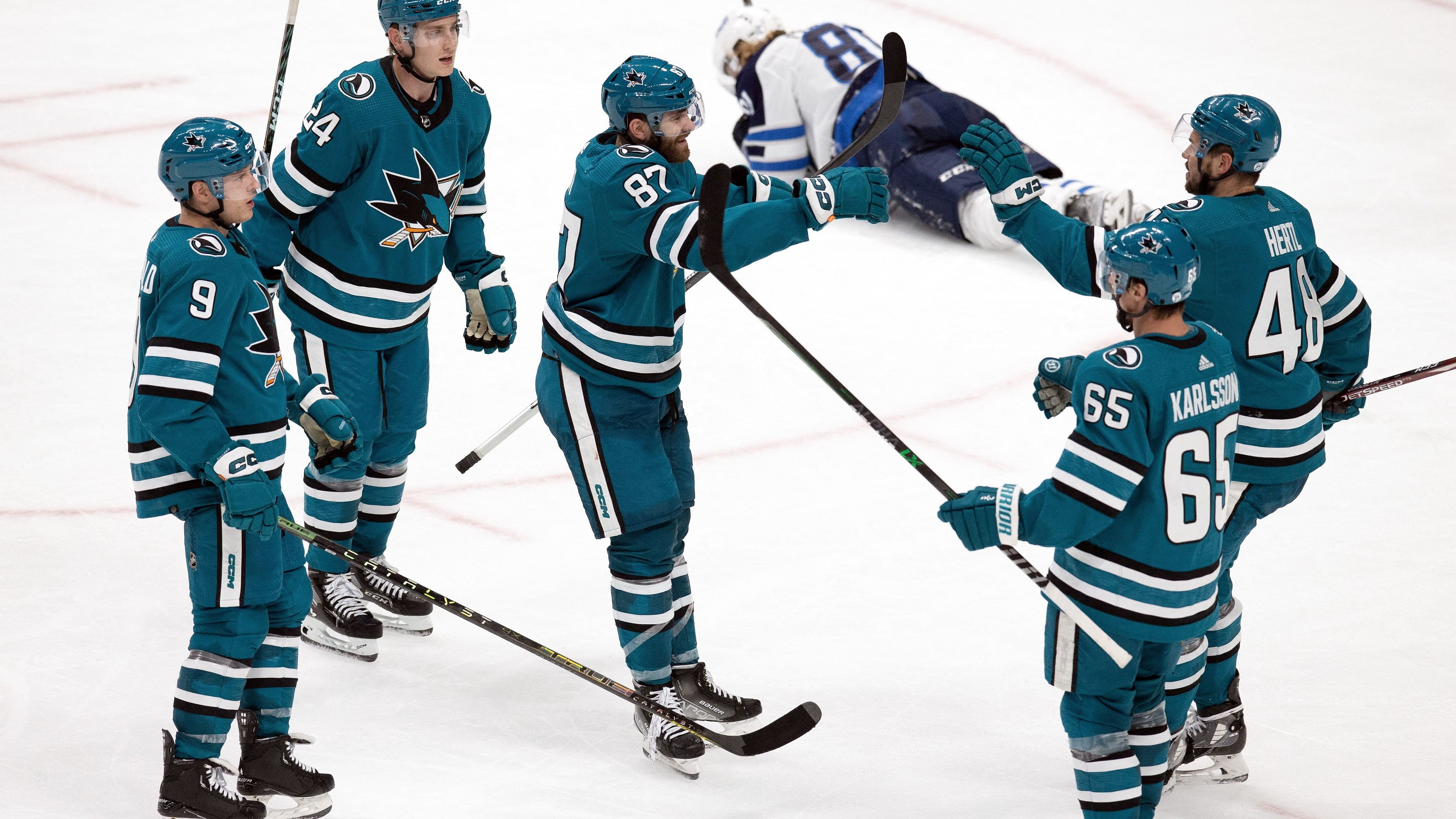 Mar 28, 2023; San Jose, California, USA; San Jose Sharks right winger Martin Kaut (87) is greeted by his teammates after scoring a goal against the Winnipeg Jets during the third period at SAP Center at San Jose. Mandatory Credit: D. Ross Cameron-USA TODAY Sports