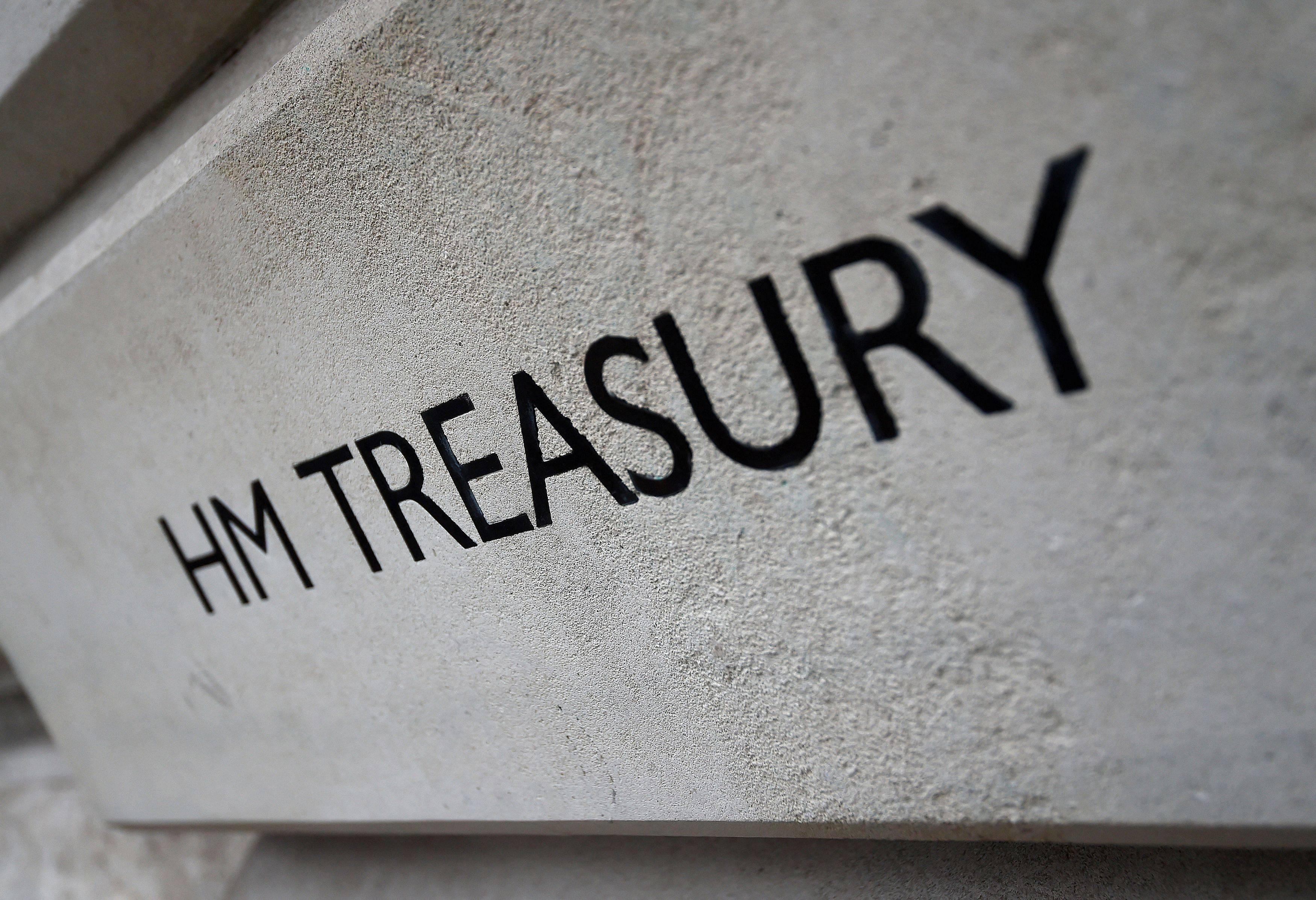 FILE PHOTO: The HM Treasury name is seen painted on the outside of Britain's Treasury building in central London, Britain March 15, 2016.  REUTERS/Toby Melville/File Photo