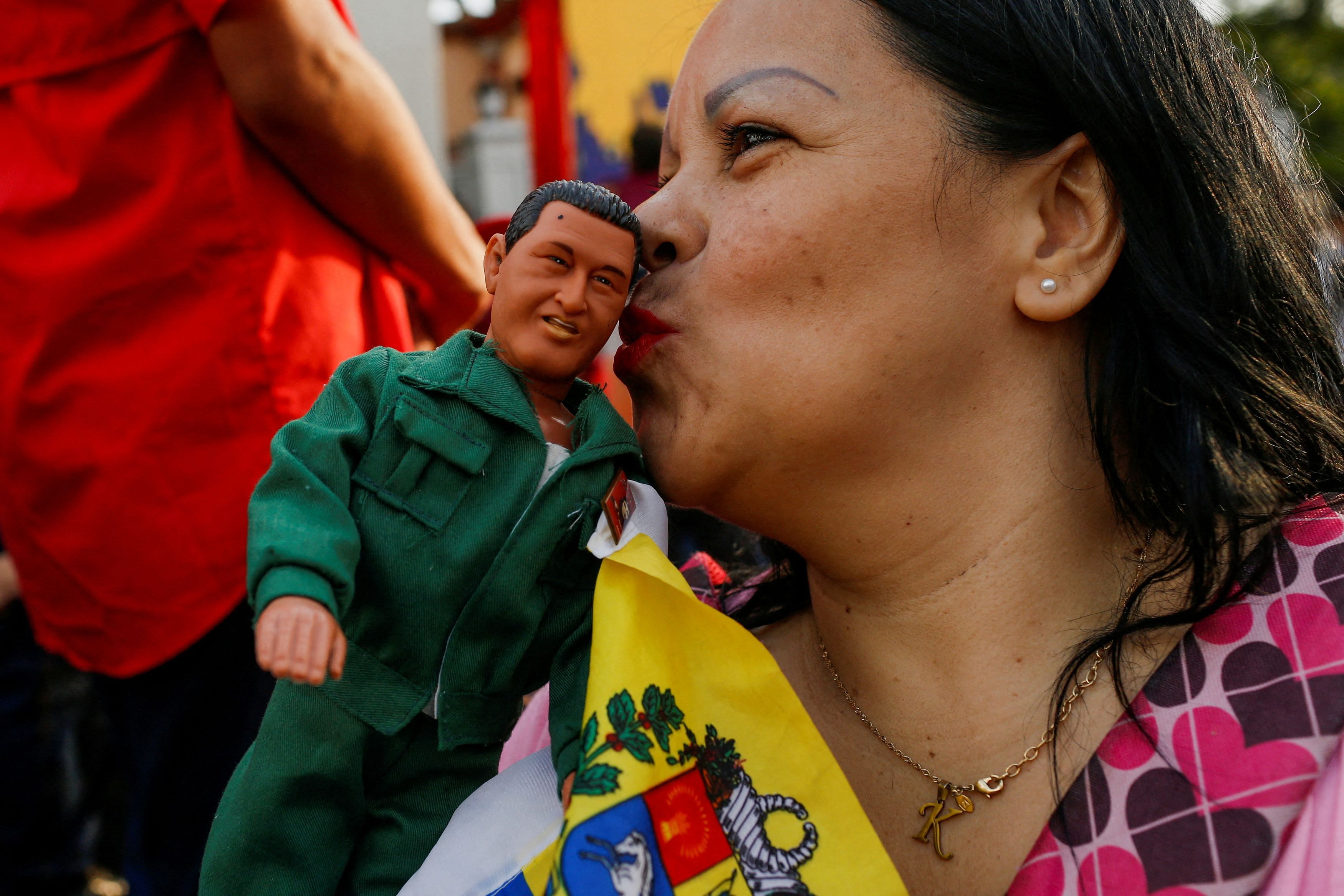 <div class="paragraphs"><p>A government supporter kisses a toy depicting late Venezuelan President Hugo Chavez during the celebration of the 21st anniversary of late President Hugo Chavez's return to power after a failed coup attempt in 2002, in Caracas, Venezuela April 13, 2023. REUTERS/Leonardo Fernandez Viloria     TPX IMAGES OF THE DAY.</p></div>