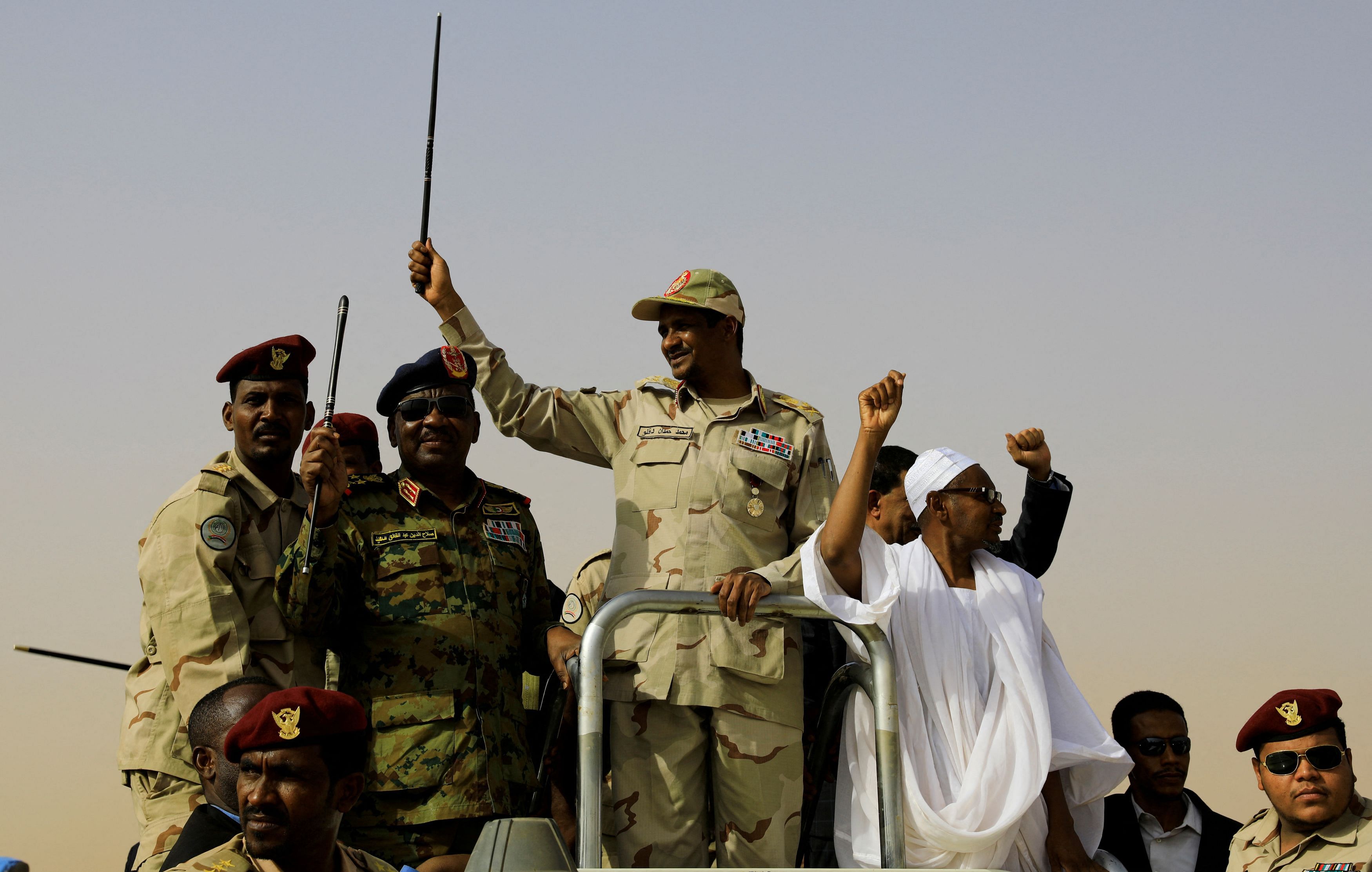 FILE PHOTO: Lieutenant General Mohamed Hamdan Dagalo, deputy head of the military council and head of paramilitary Rapid Support Forces , greets his supporters as he arrives at a meeting in Aprag village, 60 kilometers away from Khartoum, Sudan, June 22, 2019. REUTERS/Umit Bektas/File Photo