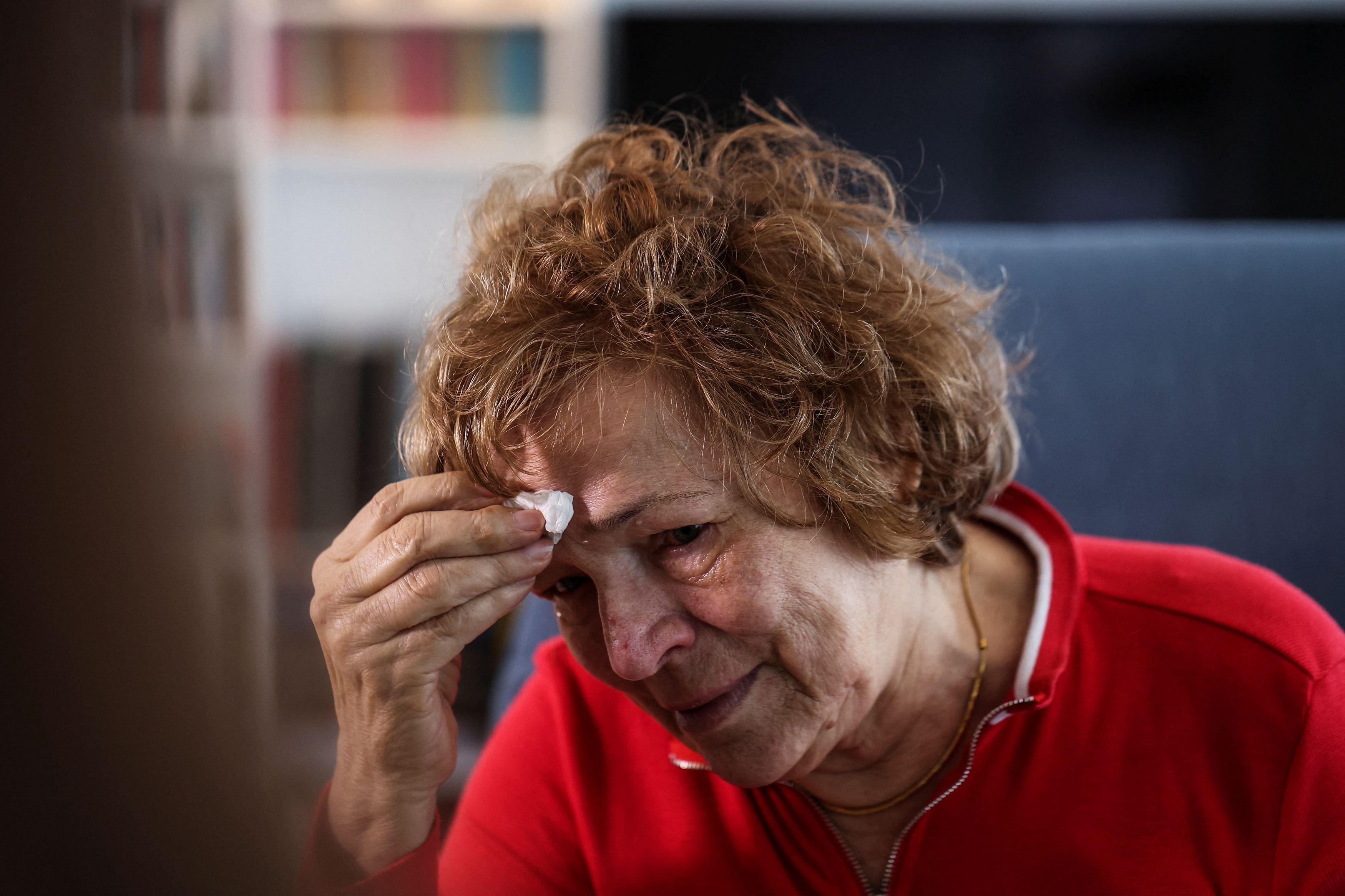 Esther Paran, 79, a Holocaust survivor from Hungary reacts as she recounts her story of survival during an interview with Reuters in her home in Tel Aviv, Israel, April 13, 2023. REUTERS/Nir Elias