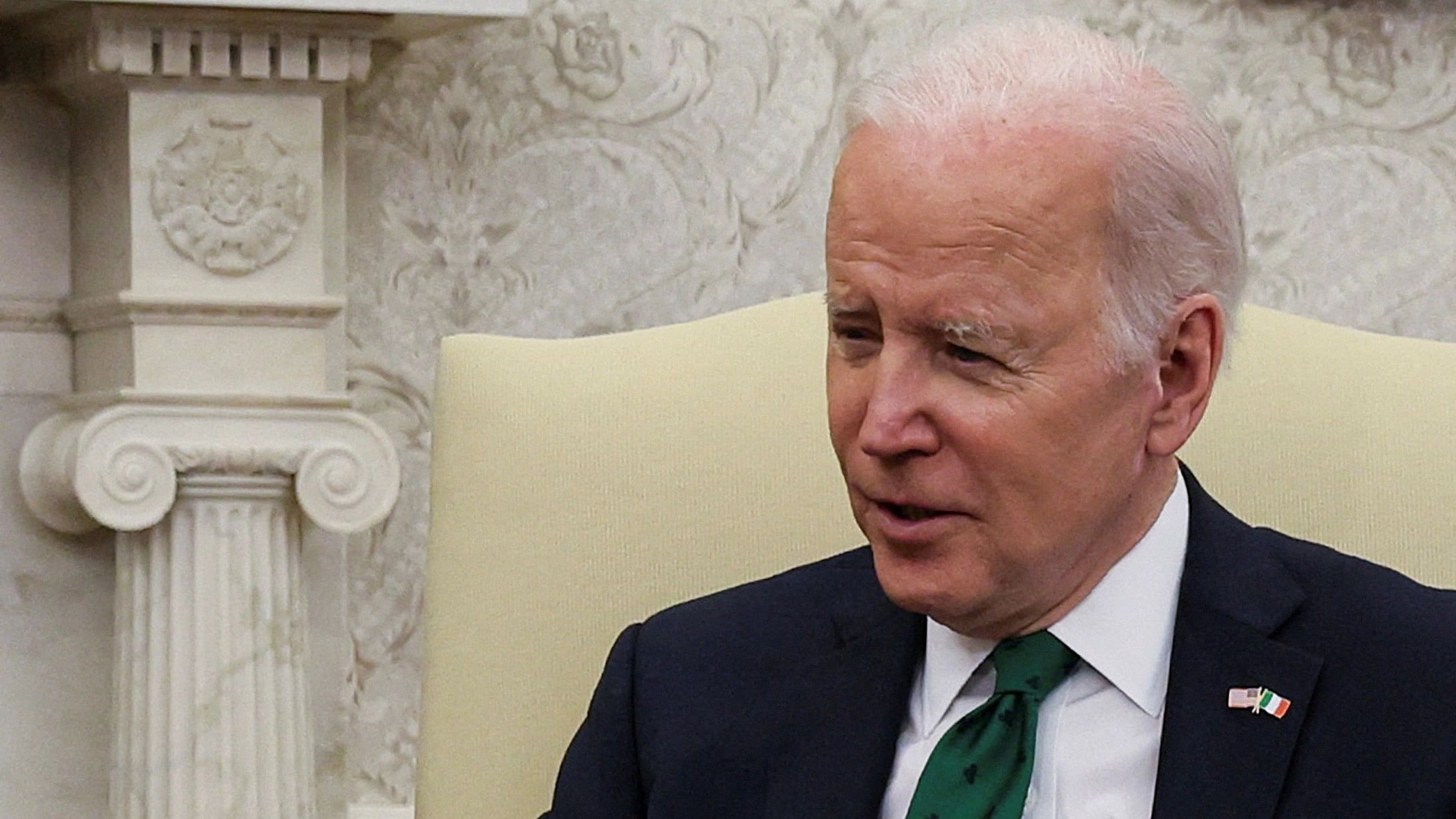 FILE PHOTO: U.S. President Joe Biden speaks while hosting a virtual St. Patrick's Day meeting with Ireland's Prime Minister Micheal Martin after Irish Taoiseach Martin tested positive for coronavirus disease  after arriving in Washington, in the Oval Office at the White House in Washington, U.S., March 17, 2022. REUTERS/Leah Millis/File Photo