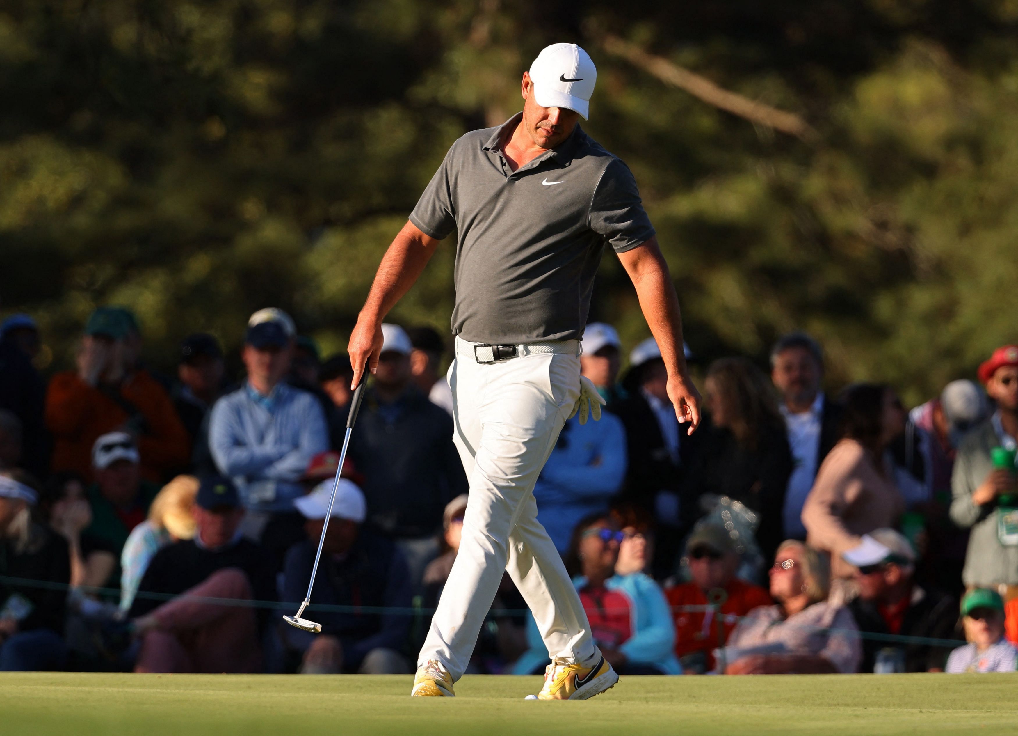 Golf - The Masters - Augusta National Golf Club - Augusta, Georgia, U.S. - April 9, 2023 Brooks Koepka of the U.S. reacts after holing his bogey putt on the 14th hole during the final round REUTERS/Mike Blake