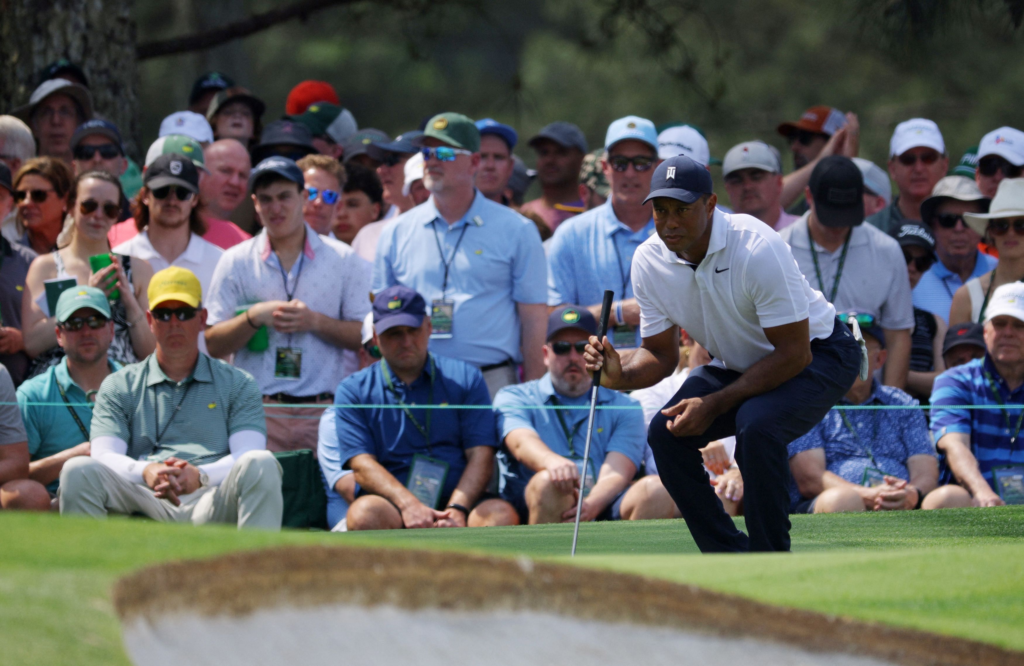 Golf - The Masters - Augusta National Golf Club - Augusta, Georgia, U.S. - April 6, 2023 Tiger Woods of the U.S. lines up a putt on the 7th hole green during the first round REUTERS/Brian Snyder