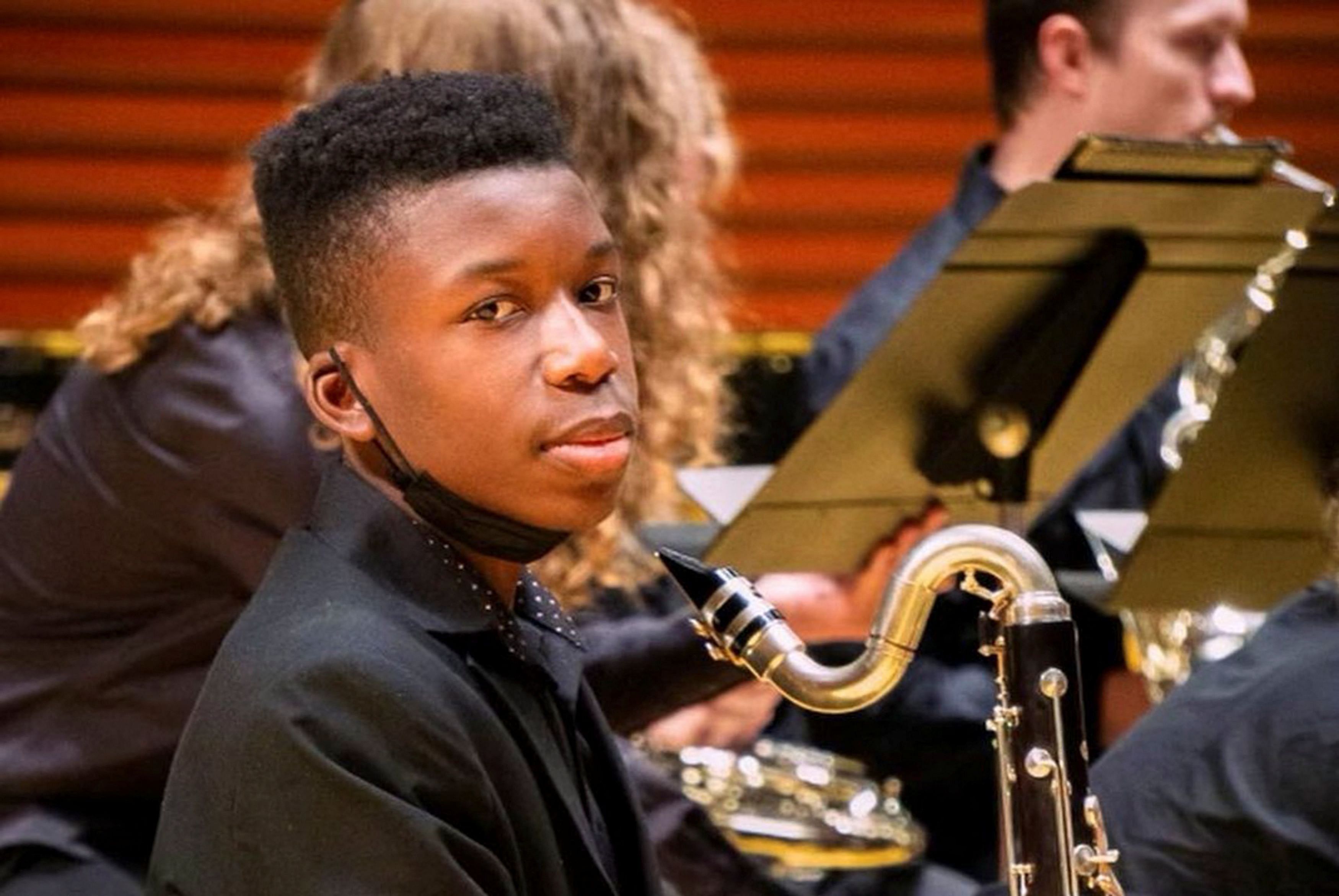 Ralph Yarl, a Black 16-year-old who was shot and wounded by a homeowner after mistakenly going to the wrong house to pick up his siblings, holds a bass clarinet in this picture obtained from social media. Lee Merritt/via REUTERS  THIS IMAGE HAS BEEN SUPPLIED BY A THIRD PARTY. MANDATORY CREDIT. NO RESALES. NO ARCHIVES. ONLY FOR EDITORIAL PURPOSES. THIS PICTURE WAS PROCESSED BY REUTERS TO ENHANCE QUALITY. AN UNPROCESSED VERSION OF THE PHOTO HAS BEEN PROVIDED SEPARATELY.