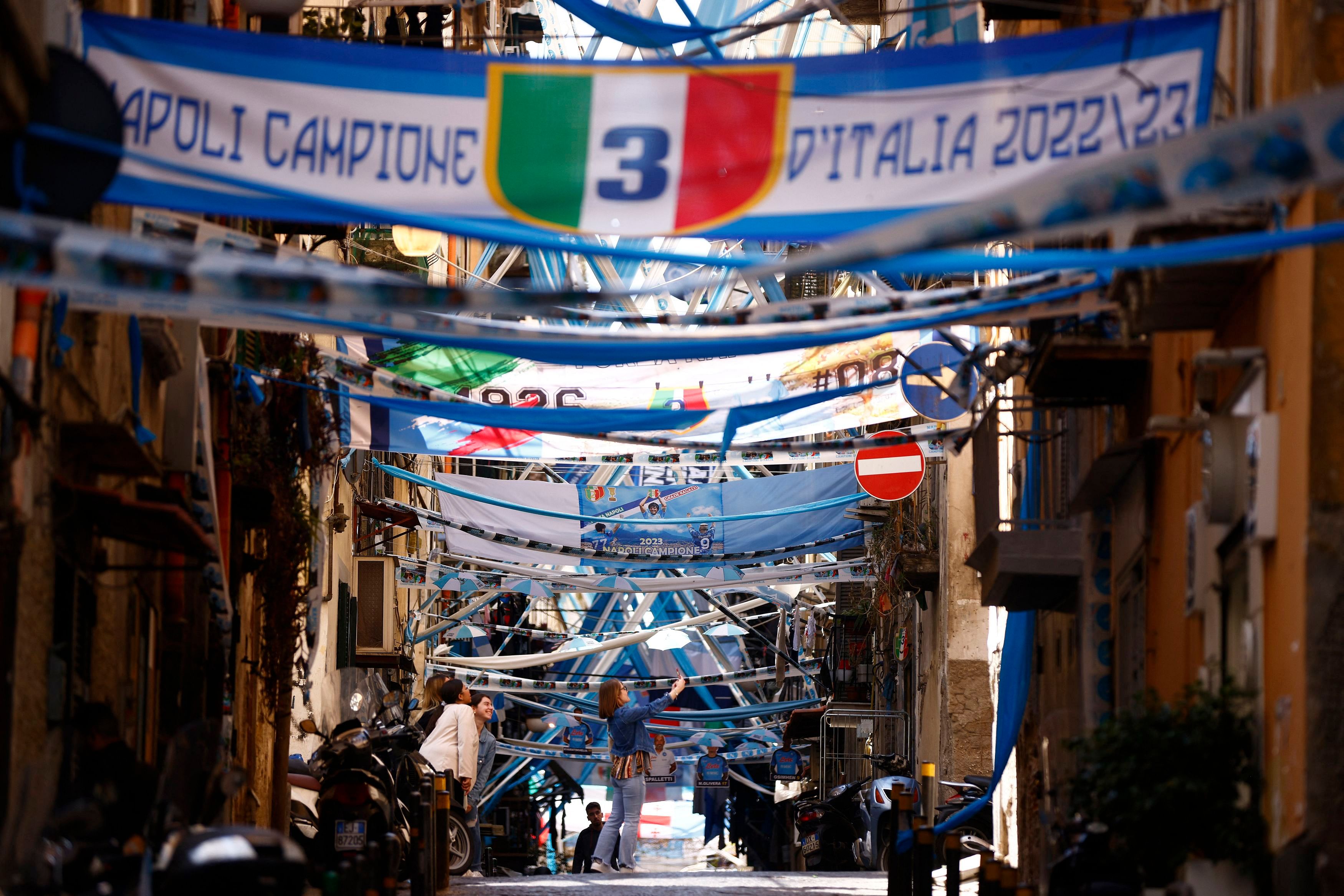 Street draped with banners, the day after after Napoli won their first Serie A title in 33 years. REUTERS