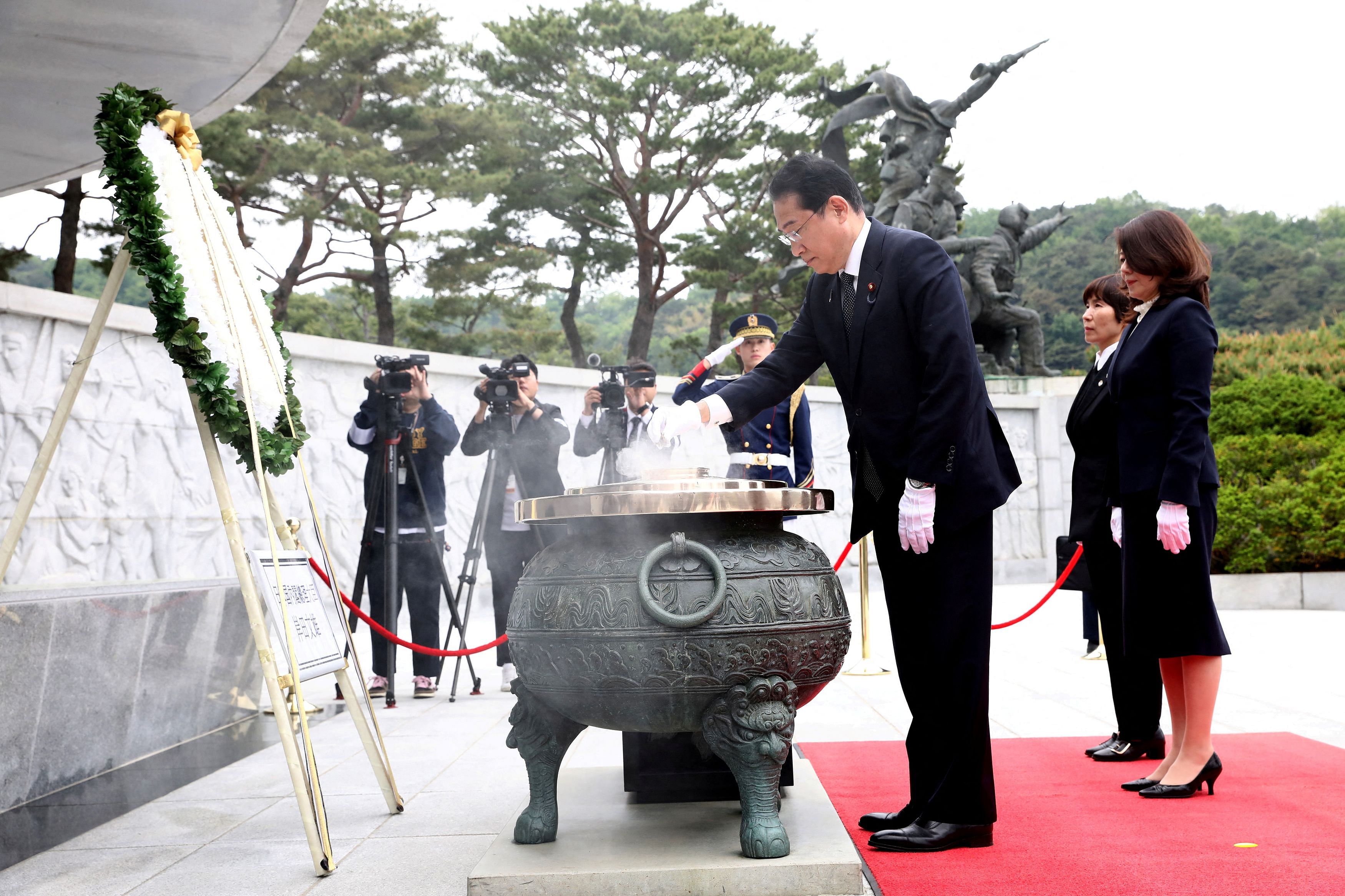 SEOUL, SOUTH KOREA - MAY 07: Japanese Prime Minister Fumio Kishida burns incense as his wife Yuko stands during a visit to National Cemetery on May 07, 2023 in Seoul, South Korea. Japanese Prime Minister Fumio Kishida is currently in South Korea for discussions with South Korean President Yoon Suk Yeol. The visit comes ahead of the upcoming G7 summit, scheduled to take place in Tokyo from May 19th to May 21st, 2023.     Chung Sung-Jun/Pool via REUTERS