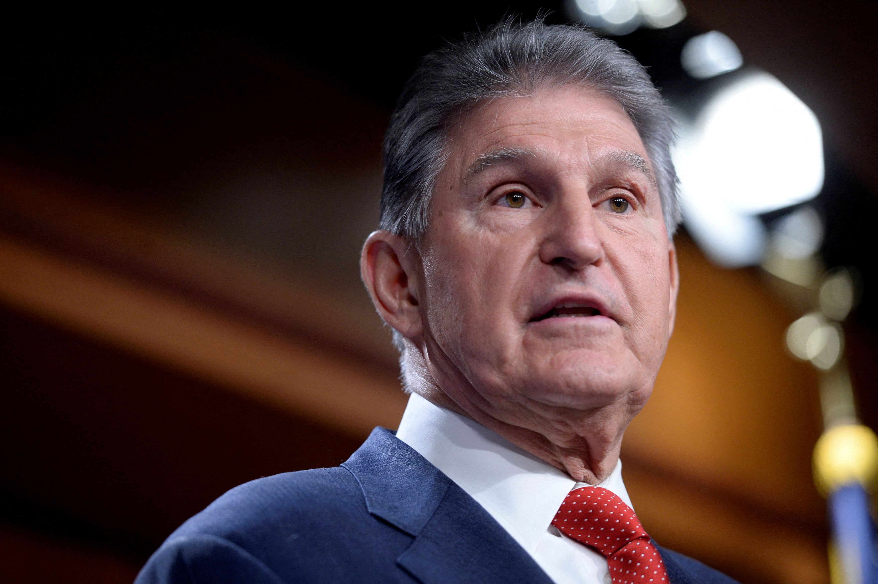 FILE PHOTO: U.S. Senator Joe Manchin  and other U.S senators  unveil legislation that would allow the Biden administration to "ban or prohibit" foreign technology products such as the Chinese-owned video app TikTok during a news conference on Capitol Hill in Washington, U.S., March 7, 2023. REUTERS/Bonnie Cash/File Photo