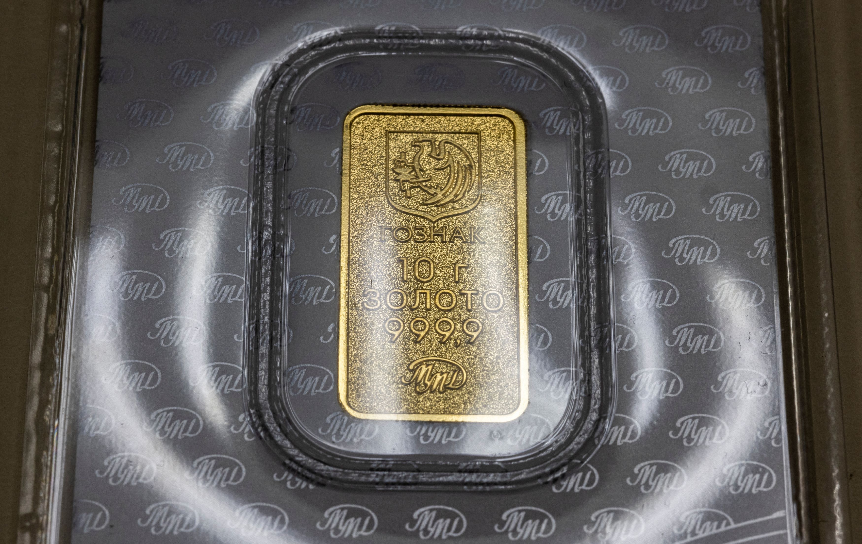 A 10-gram gold ingot is on display at a branch of Goznak joint stock company, the Moscow Mint, that announced the beginning of minted gold bars sale to individuals, in Moscow, Russia, May 22, 2023. REUTERS/Maxim Shemetov