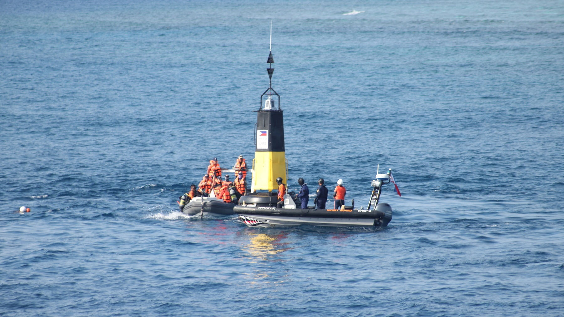 Scene from the Philippine Coast Guard's installation of navigational buoys in the Philippines' exclusive economic zone in the South China Sea, in this handout image obtained on May 15, 2023. Philippine Coast Guard/Handout via REUTERS    THIS IMAGE HAS BEEN SUPPLIED BY A THIRD PARTY. NO RESALES. NO ARCHIVES.