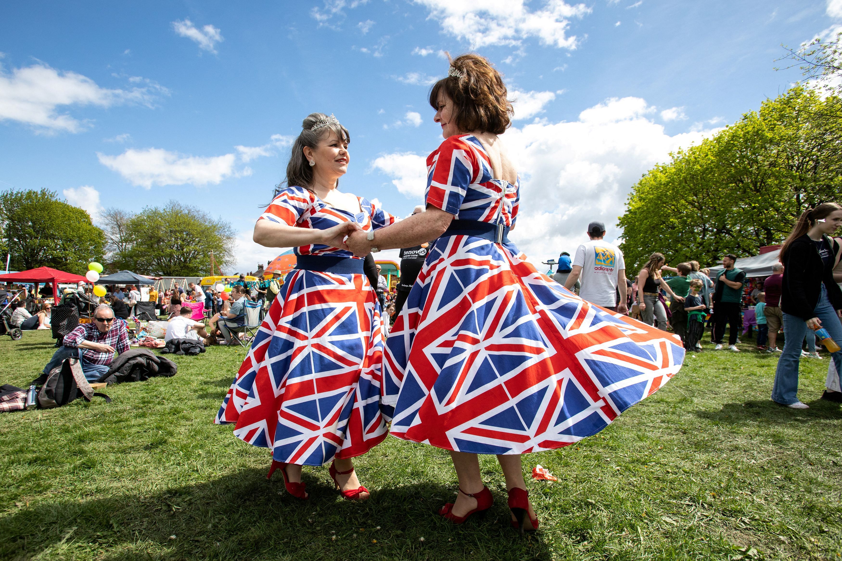 Laura Bridgewater and Joan Hoctor from the band "Gentlemen Prefer Blondes" entertain the crowds at the 10th Calon Hearts, Cardiff Carnival, Wales, Britain May 1, 2023. This years charity event is to celebrate the coming coronation of King Charles. REUTERS/Joann Randles