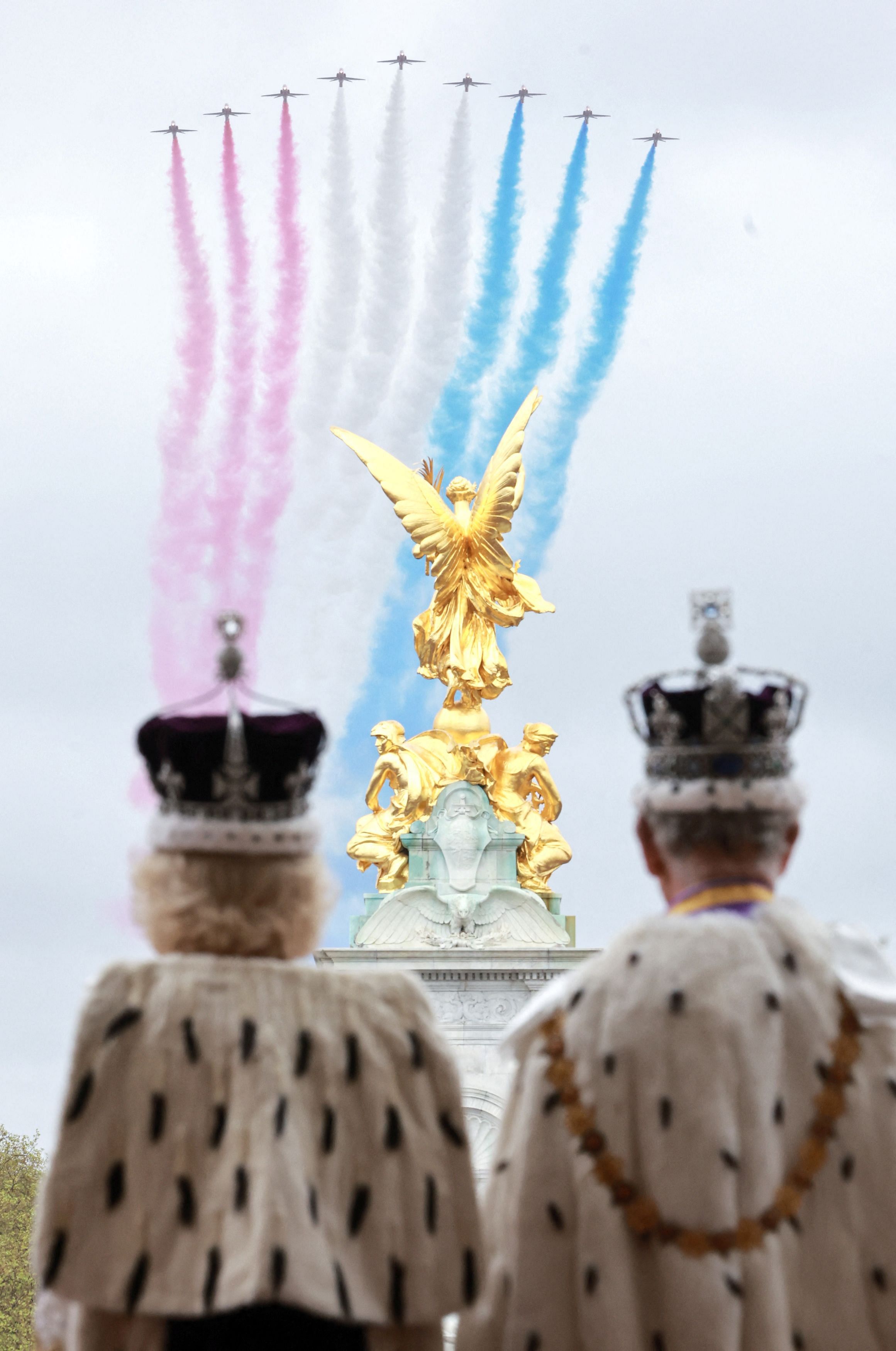 A handout image released by Buckingham Palace showing Britain's King Charles III and Queen Camilla  as they watch the flypast from the balcony of Buckingham Palace after their coronation on May 6, 2023 in London, Britain. Chris Jackson for Buckingham Palace/ Handout via REUTERS    THIS IMAGE HAS BEEN SUPPLIED BY A THIRD PARTY. NO RESALES. NO ARCHIVES MANDATORY CREDIT.  NEWS EDITORIAL USE ONLY. IMAGES MAY ONLY BE USED IN RELATION TO THE CORONATION OF KING CHARLES III. NO COMMERCIAL USE.  COPYRIGHT VESTS WITH GETTY IMAGES AND PUBLICATIONS ARE ASKED TO CREDIT CHRIS JACKSON/GETTY IMAGES. ALL TERMS OF RELEASE MUST BE ADHERED TO. THE PHOTOGRAPH HAS BEEN DISTRIBUTED WITH PERMISSION FROM ROYAL COMMUNICATIONS. THE PHOTOGRAPH IS BEING MADE AVAILABLE BY WAY OF LICENCE ON CONDITION THAT: THE IMAGE SHALL BE SOLELY FOR NEWS EDITORIAL USE ONLY. THE IMAGE SHOULD BE USED ONLY IN THE CONTEXT OF THE CORONATION OF KING CHARLES III. NO CHARGE SHOULD BE MADE FOR THE SUPPLY, RELEASE OR PUBLICATION OF THE IMAGE. THERE SHALL BE NO COMMERCIAL USE WHATSOEVER OF THE IMAGE .  THE IMAGE SHALL NOT BE USED AFTER 0001HRS, MONDAY 22ND MAY. AFTER THAT DATE, NO FURTHER LICENSING CAN BE MADE, PLEASE REMOVE FROM YOUR SYSTEMS AND CONTACT GETTY IMAGES FOR ANY USAGE.