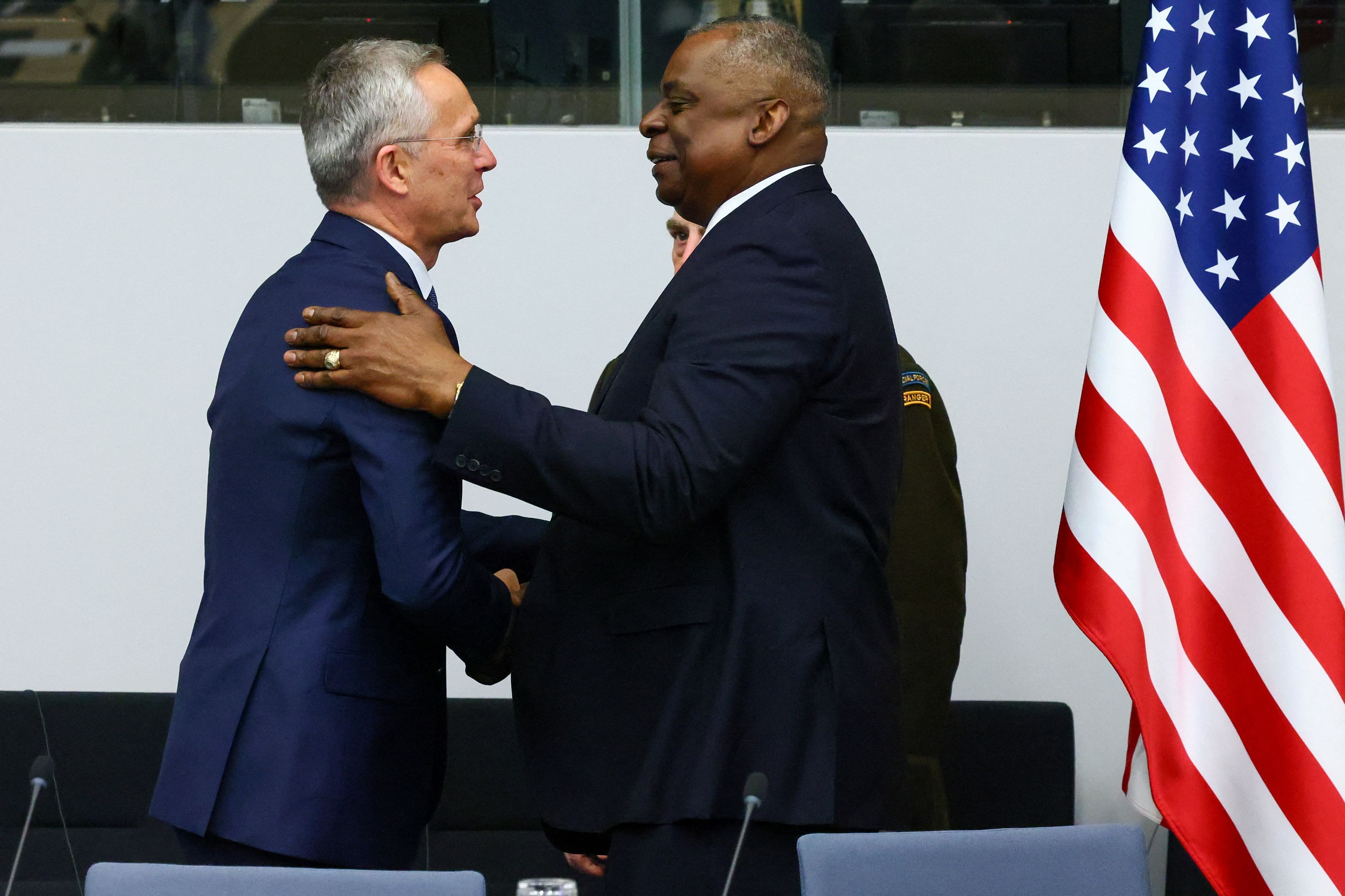 NATO Secretary General Jens Stoltenberg greets U.S. Secretary of Defense Lloyd Austin next to U.S. Chairman of the Joint Chiefs of Staff  Mark Milley during a meeting of the Ukraine Defense Contact Group, as a part of a NATO Defence Ministers' meeting at the Alliance's headquarters in Brussels, Belgium June 15, 2023. REUTERS/Yves Herman