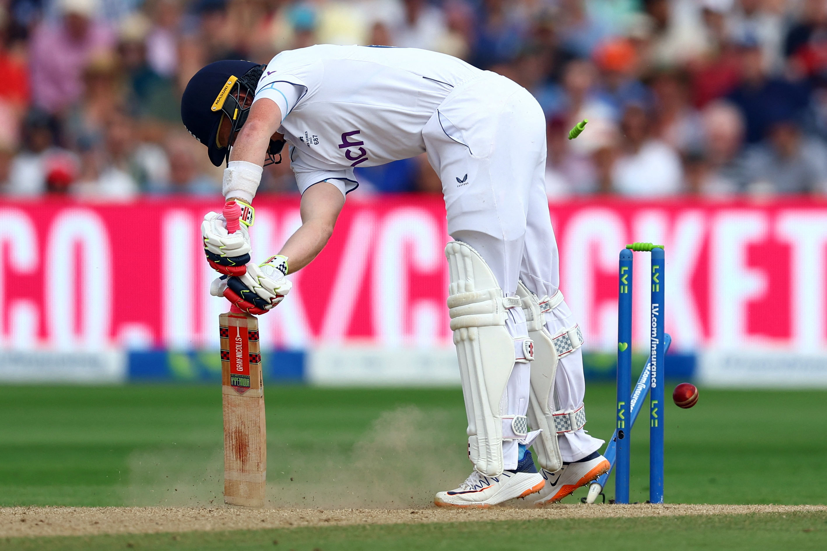 Cricket - Ashes - First Test - England v Australia - Edgbaston Cricket Ground, Birmingham, Britain - June 19, 2023 England's Joe Root is bowled out by Australia's Pat Cummins Action Images via Reuters/Paul Childs