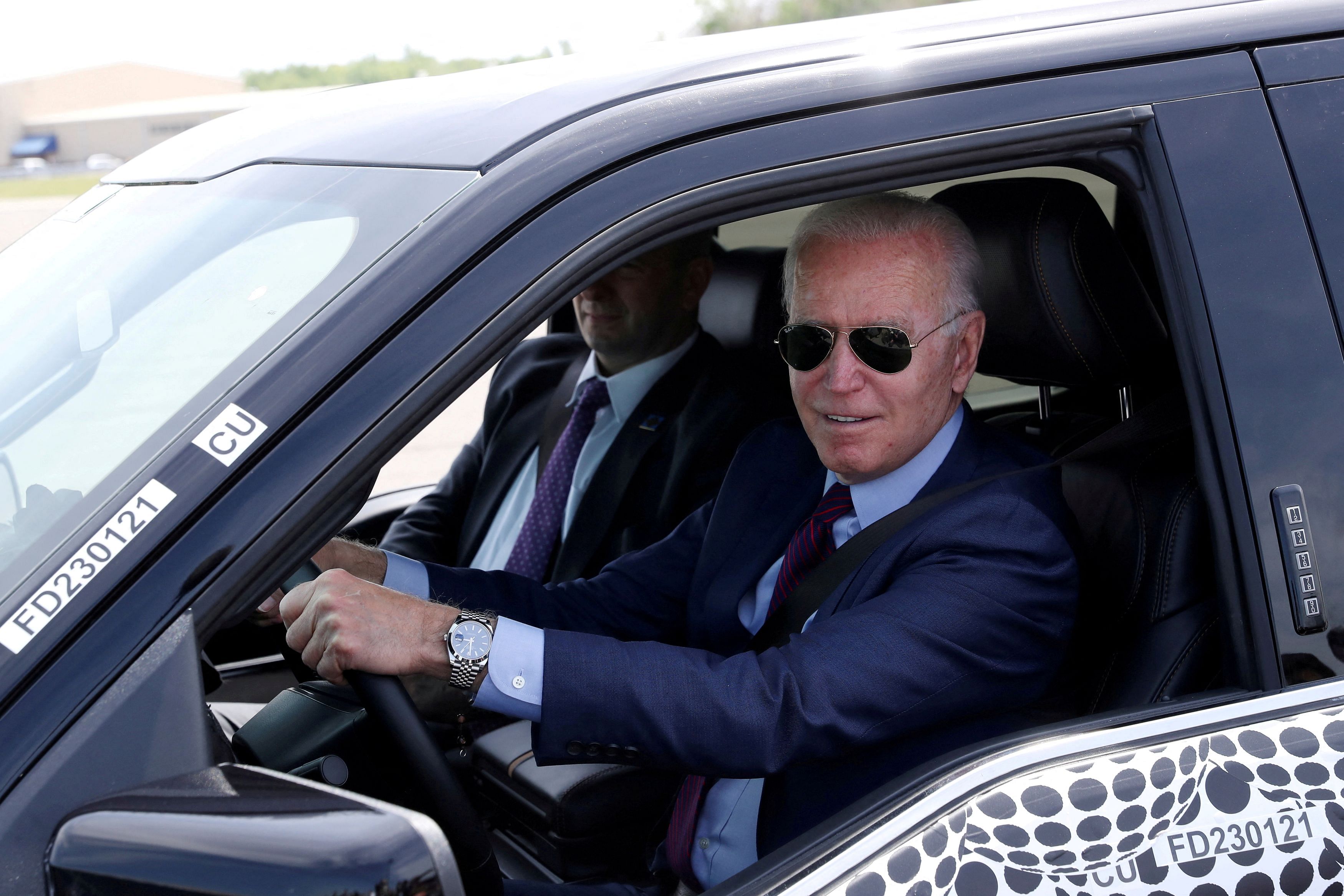 FILE PHOTO: U.S. President Joe Biden tests the new Ford F-150 Lightning truck as he visits VDAB at Ford Dearborn Development Center in Dearborn, Michigan, U.S., May 18, 2021.  REUTERS/Leah Millis/File Photo