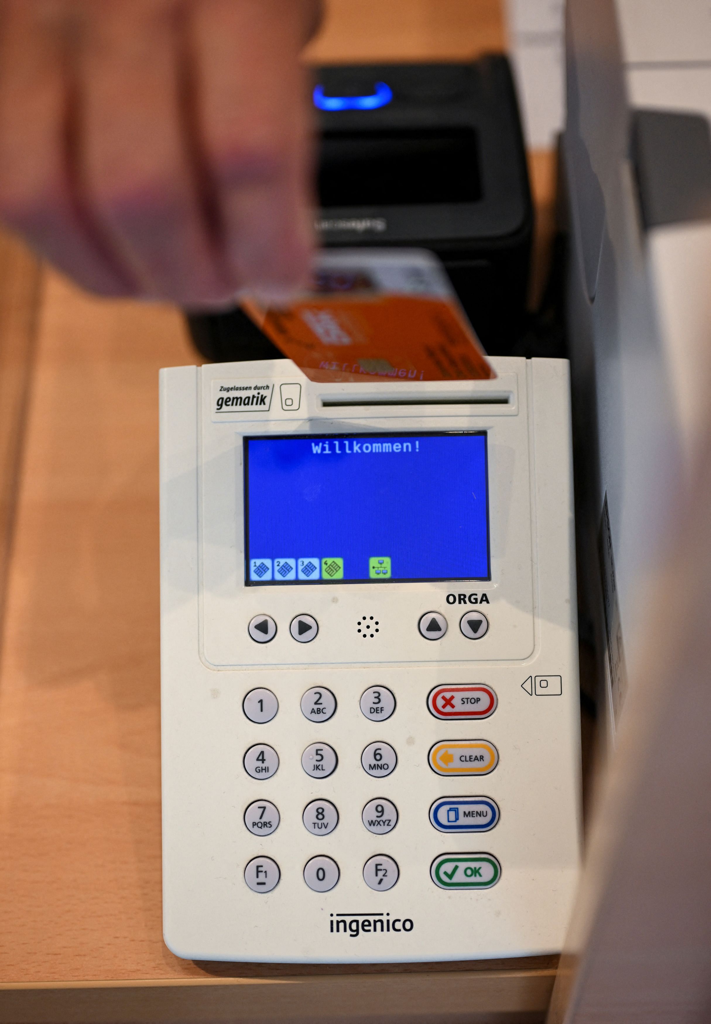 A person places a patient's health card in a card reader at a pharmacy, during a presentation of the new process for issuing an e-prescription, in Berlin, Germany August 9, 2023. REUTERS/Annegret Hilse/Pool