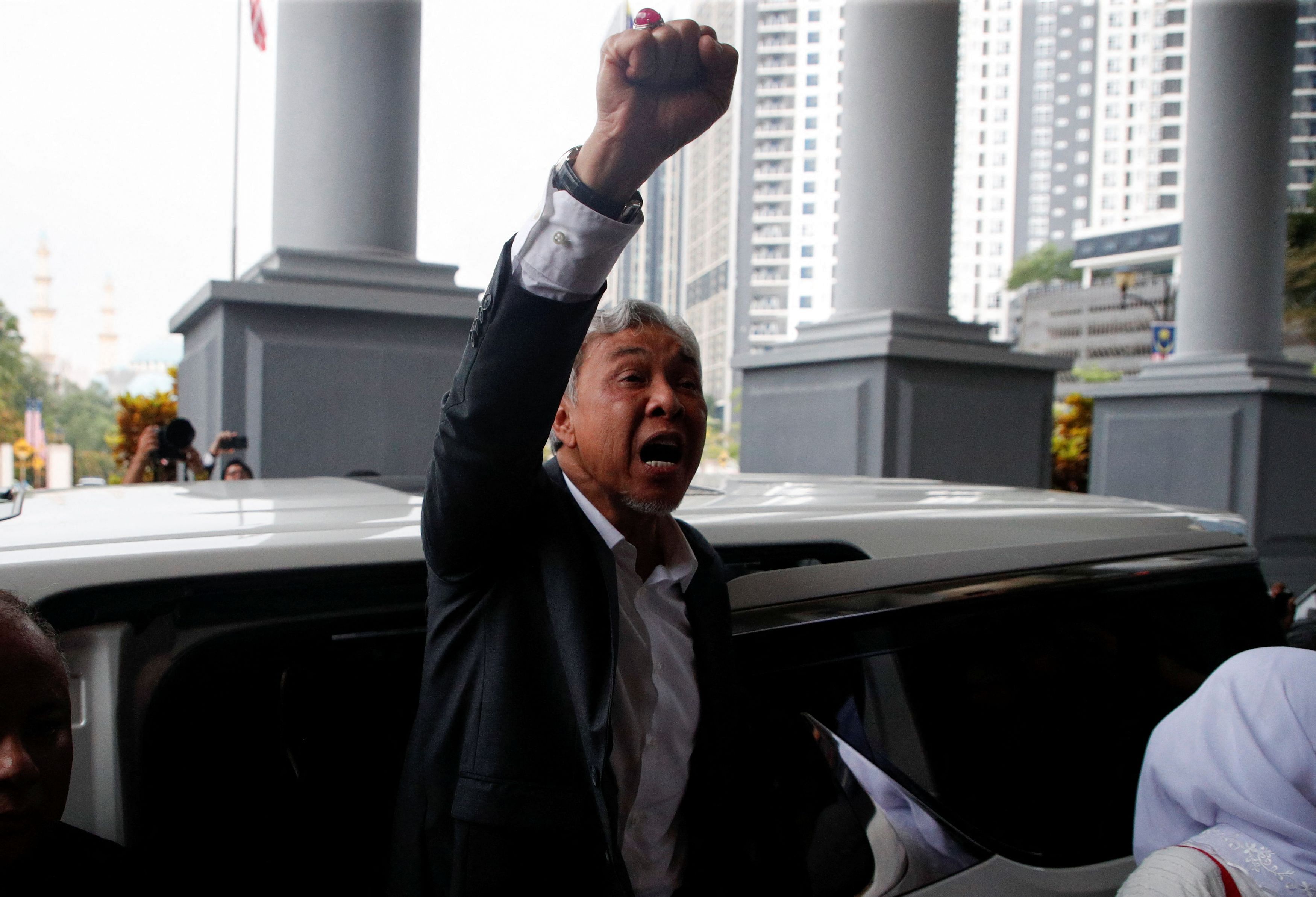 Malaysian Deputy Prime Minister and current president of the UMNO party Ahmad Zahid Hamidi raises his fist as he leaves the Kuala Lumpur High Court complex after the court dropped corruption charges against him, in Kuala Lumpur, Malaysia September 4, 2023. REUTERS/Hasnoor Hussain