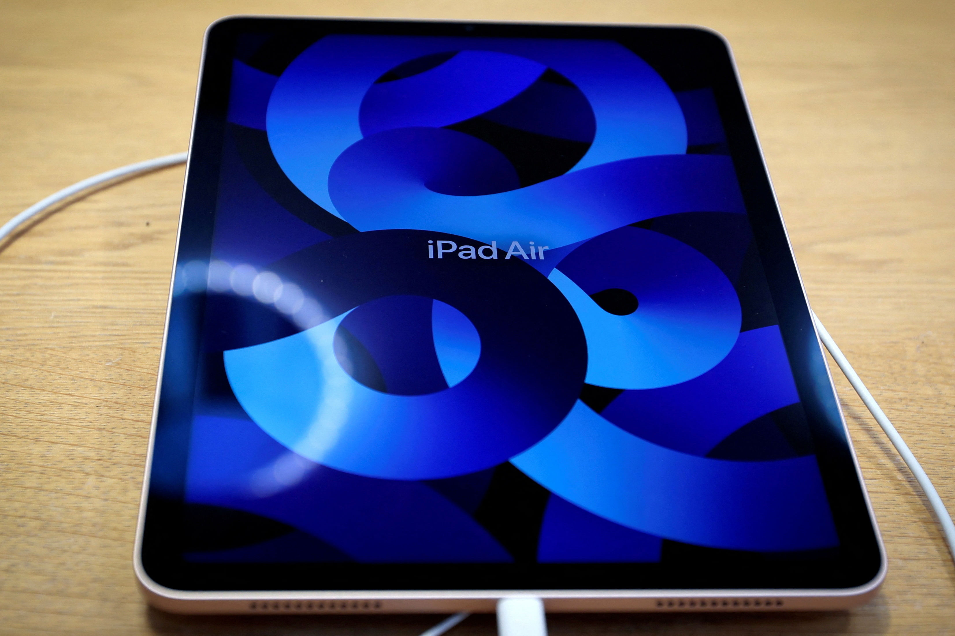 FILE PHOTO: The new Apple iPad Air tablet is displayed shortly after it went on sale at the Apple Store on 5th Avenue in Manhattan in New York City, New York, U.S., March 18, 2022. REUTERS/Mike Segar/File Photo