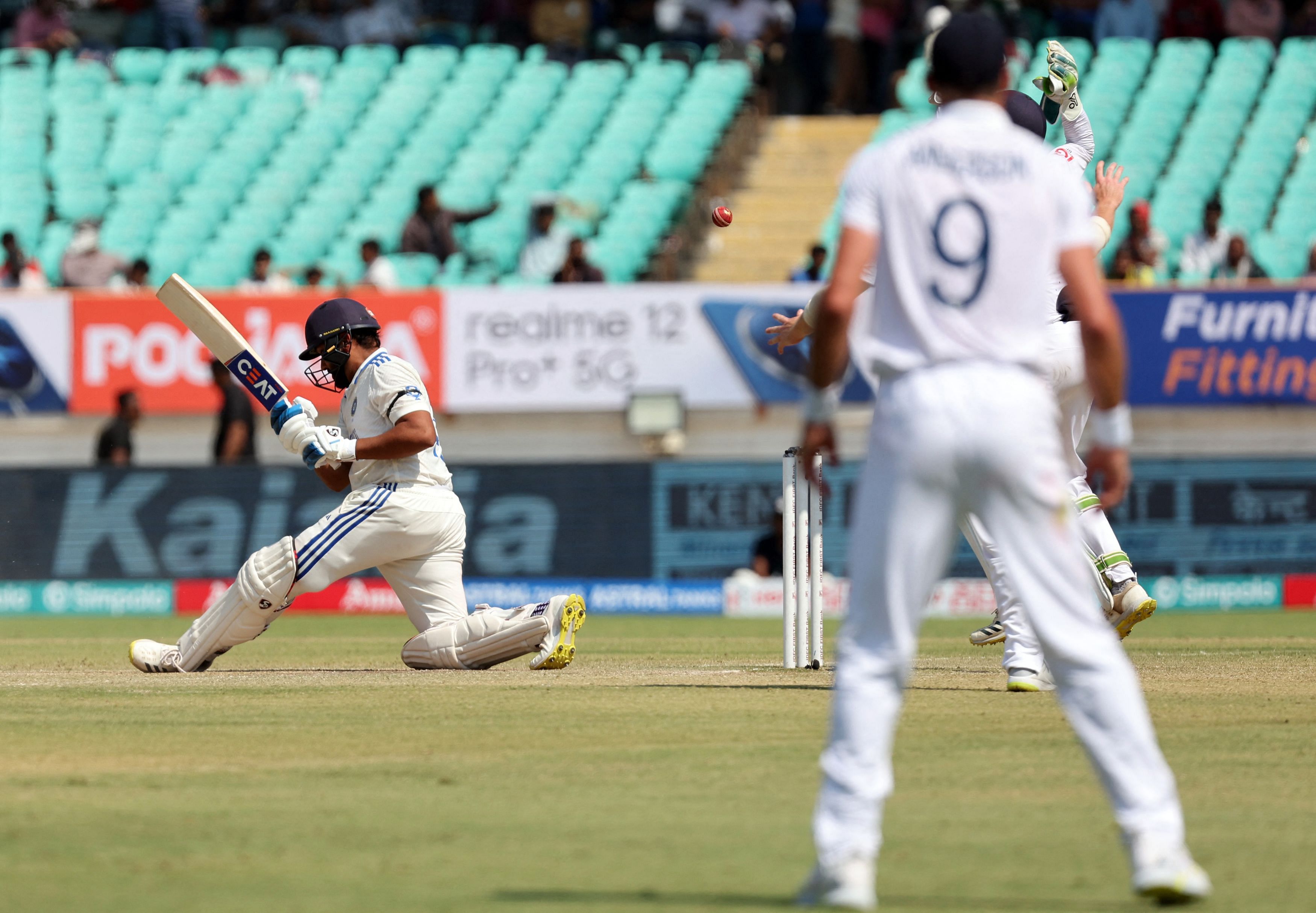Cricket - Third Test - India v England - Niranjan Shah Stadium, Rajkot, India - February 17, 2024 India's Rohit Sharma in action before losing his wicket, lbw bowled by England's Joe Root after a successful DRS review REUTERS/Amit Dave