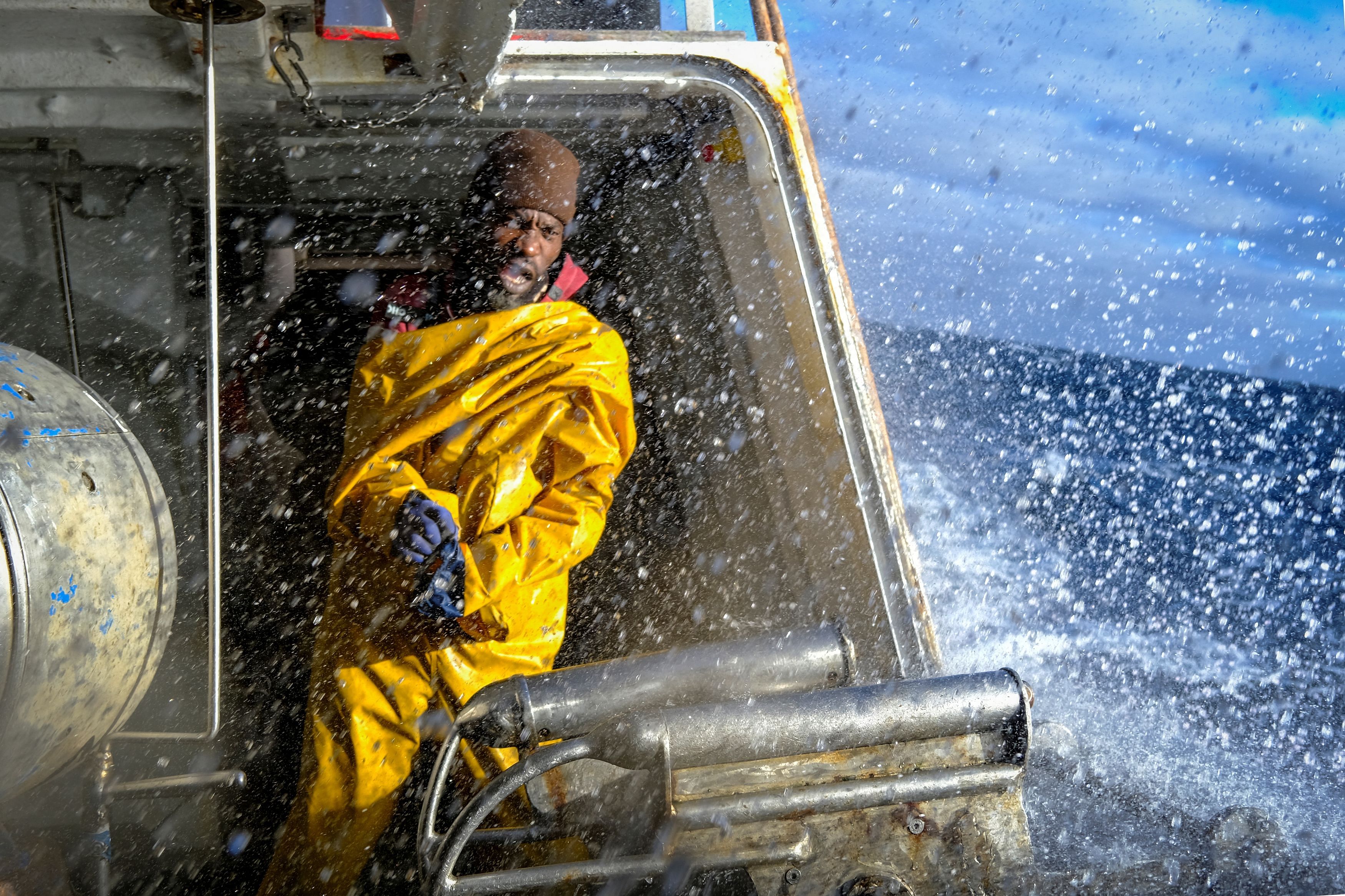 <div class="paragraphs"><p>Mamadou Sarr, 38, a fisherman from Senegal, puts on his raincoat before collecting the nets with the catch on the Sarridal ship, on the Atlantic Ocean near Sisargas Islands, Galicia, Spain.</p></div>