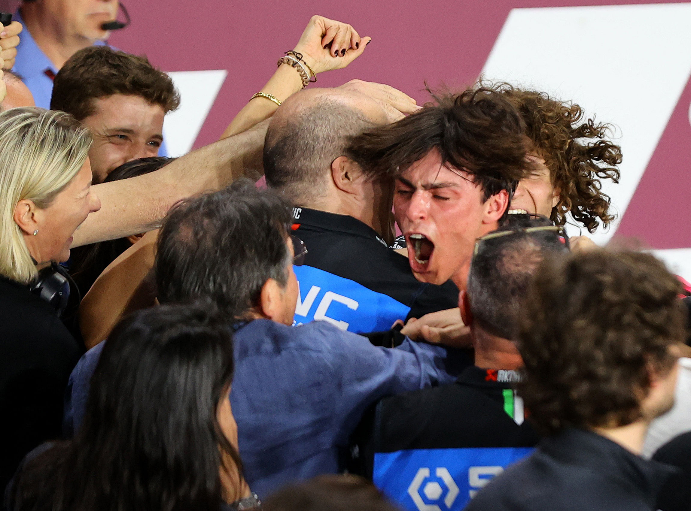 MotoGP - Grand Prix of Qatar - Lusail International Circuit, Lusail, Qatar - March 10, 2024 Sync SpeedUp's Alonso Lopez celebrates with teammates after winning the Moto2 race REUTERS/Ibraheem Al Omari