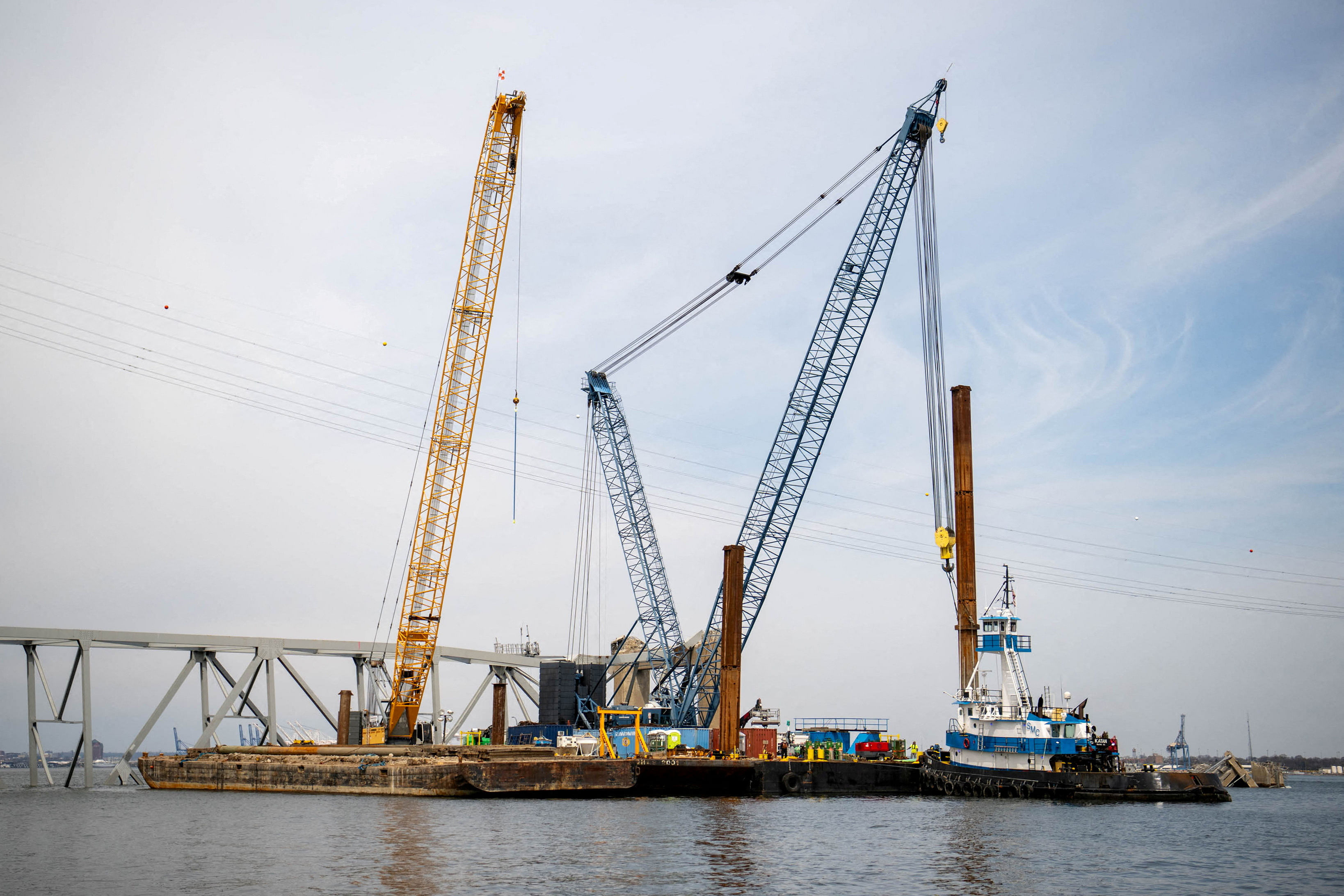 FILE PHOTO: Barge cranes are shown near the collapsed Francis Scott Key Bridge on the Patapsco River, in Baltimore, Maryland, U.S. March 30, 2024.  U.S. Coast Guard/Petty Officer 2nd Class Taylor Bacon/Handout via REUTERS  THIS IMAGE HAS BEEN SUPPLIED BY A THIRD PARTY/File Photo