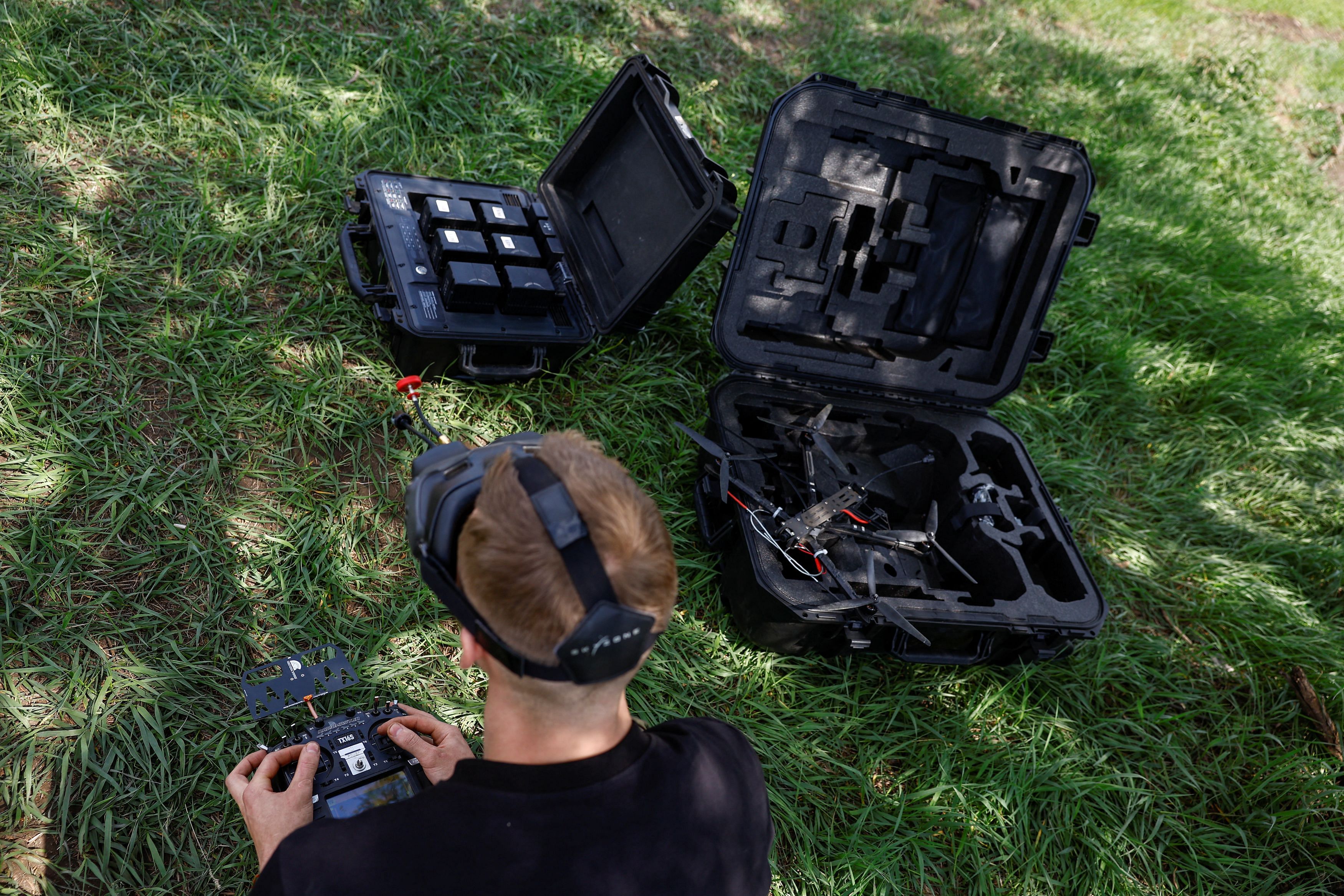 A Ukrainian serviceman of the 28th Separate Mechanised Brigade with the call sign 'Sokil'  drone during a test flight at a training ground, amid Russia's attack on Ukraine, in Donetsk Region, Ukraine May 3, 2024. REUTERS/Valentyn Ogirenko