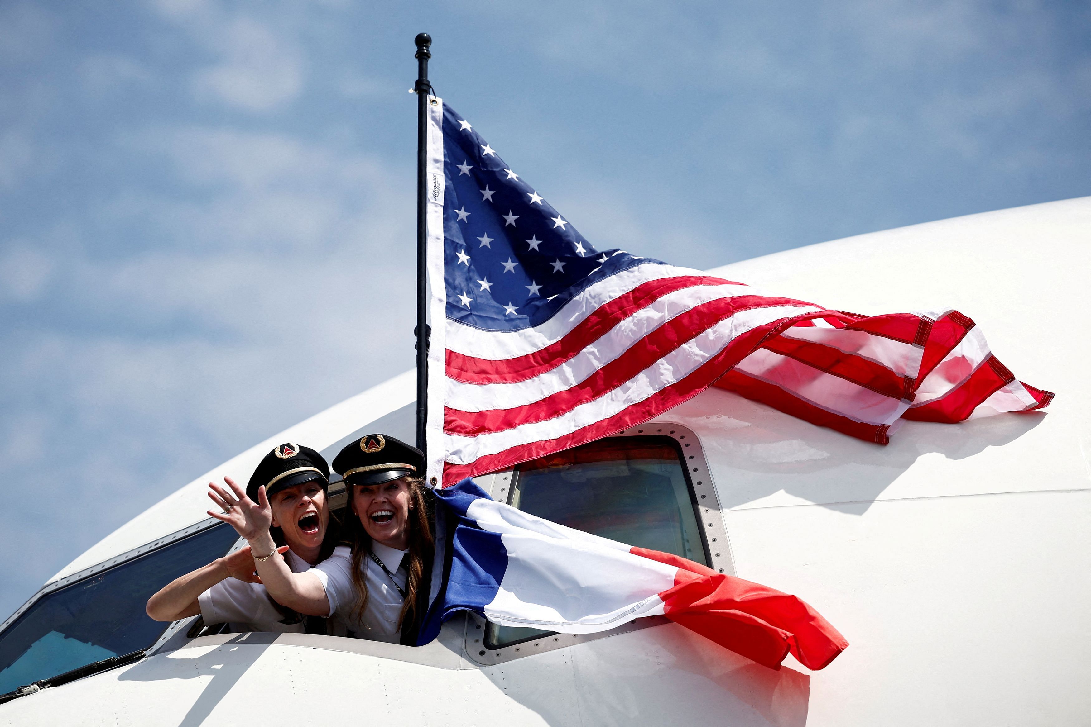 <div class="paragraphs"><p>Delta Air Lines First Officers Theresa Livingston and Abby Kent, both of whom are U.S. military veterans, wave from the cockpit of the plane they.</p></div>