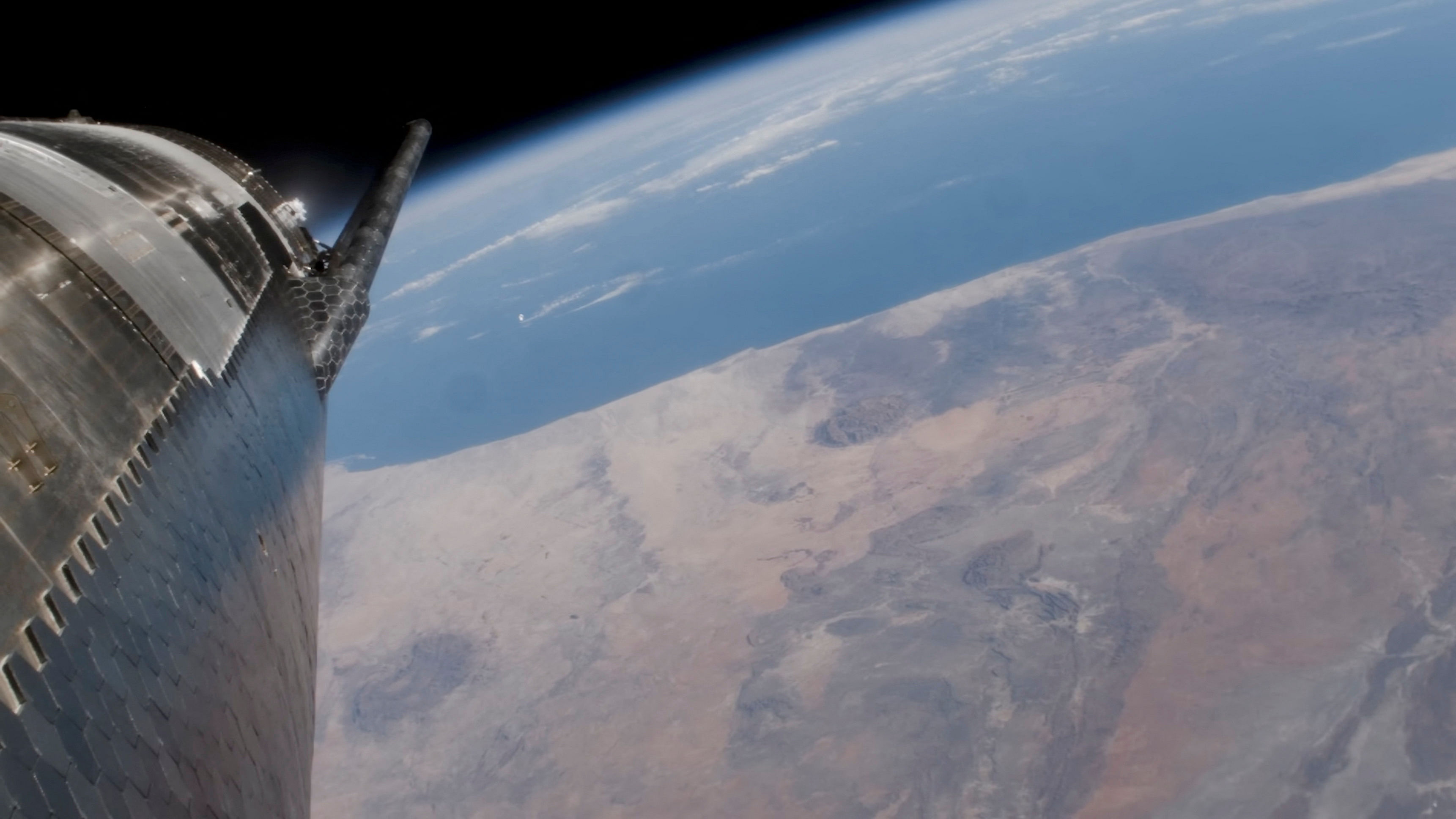 SpaceX Starship passes over the earth during its fourth flight test from the company's Boca Chica launchpad, near Brownsville, Texas, U.S. June 6, 2024, in a still image from video.  SpaceX/Handout via REUTERS.  NO RESALES. NO ARCHIVES. THIS IMAGE HAS BEEN SUPPLIED BY A THIRD PARTY