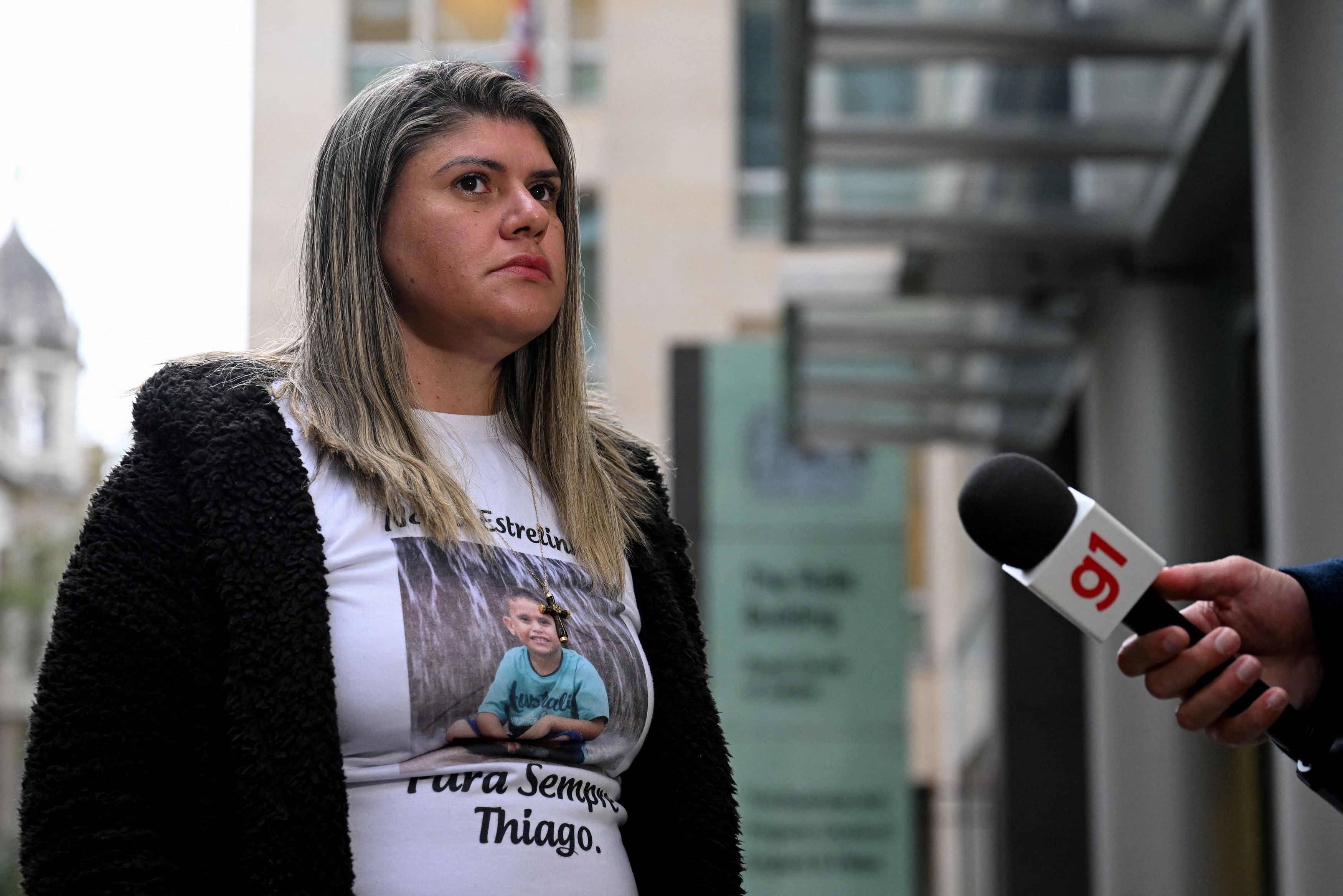 <div class="paragraphs"><p>Gelvana Rodrigues, wearing a T-shirt with an image of her son Thiago, who died as a result of the 2015 collapse of the Mariana dam in Brazil.</p></div>