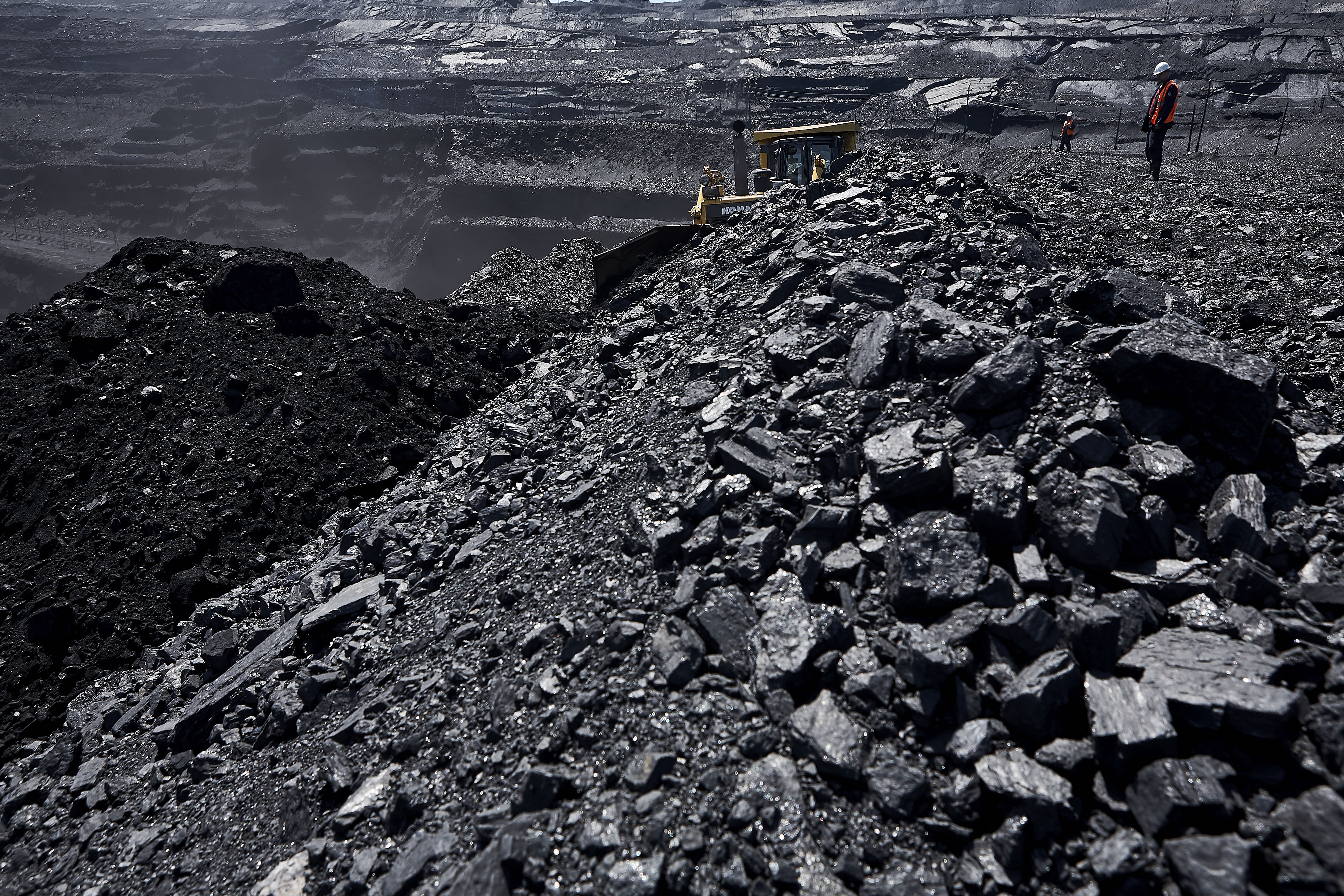 Big black coal mine with machines