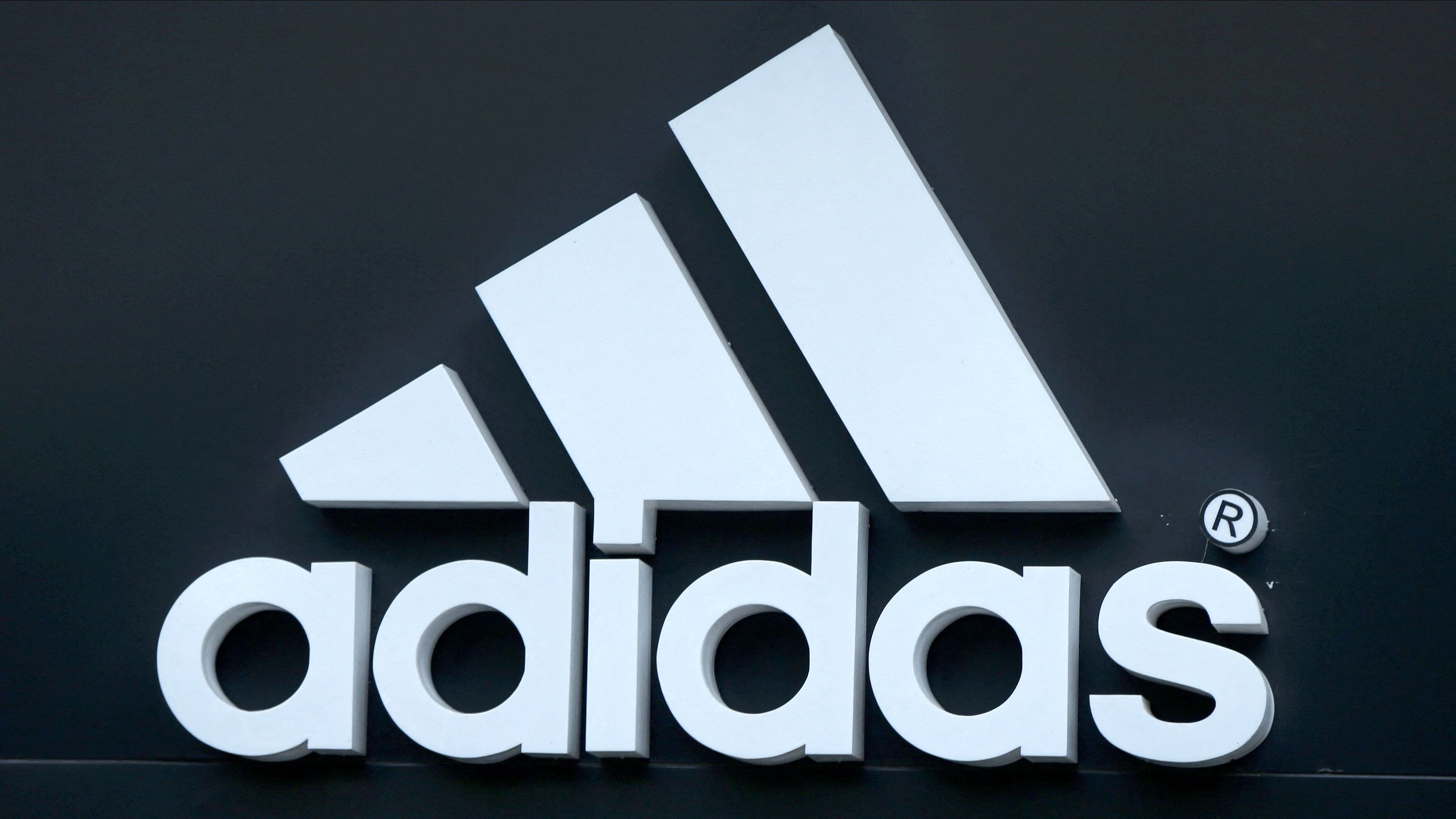 FILE PHOTO: The logo of Adidas logo is seen on ta store in Yerevan, Armenia, June 23, 2016. REUTERS/David Mdzinarishvili/File Photo