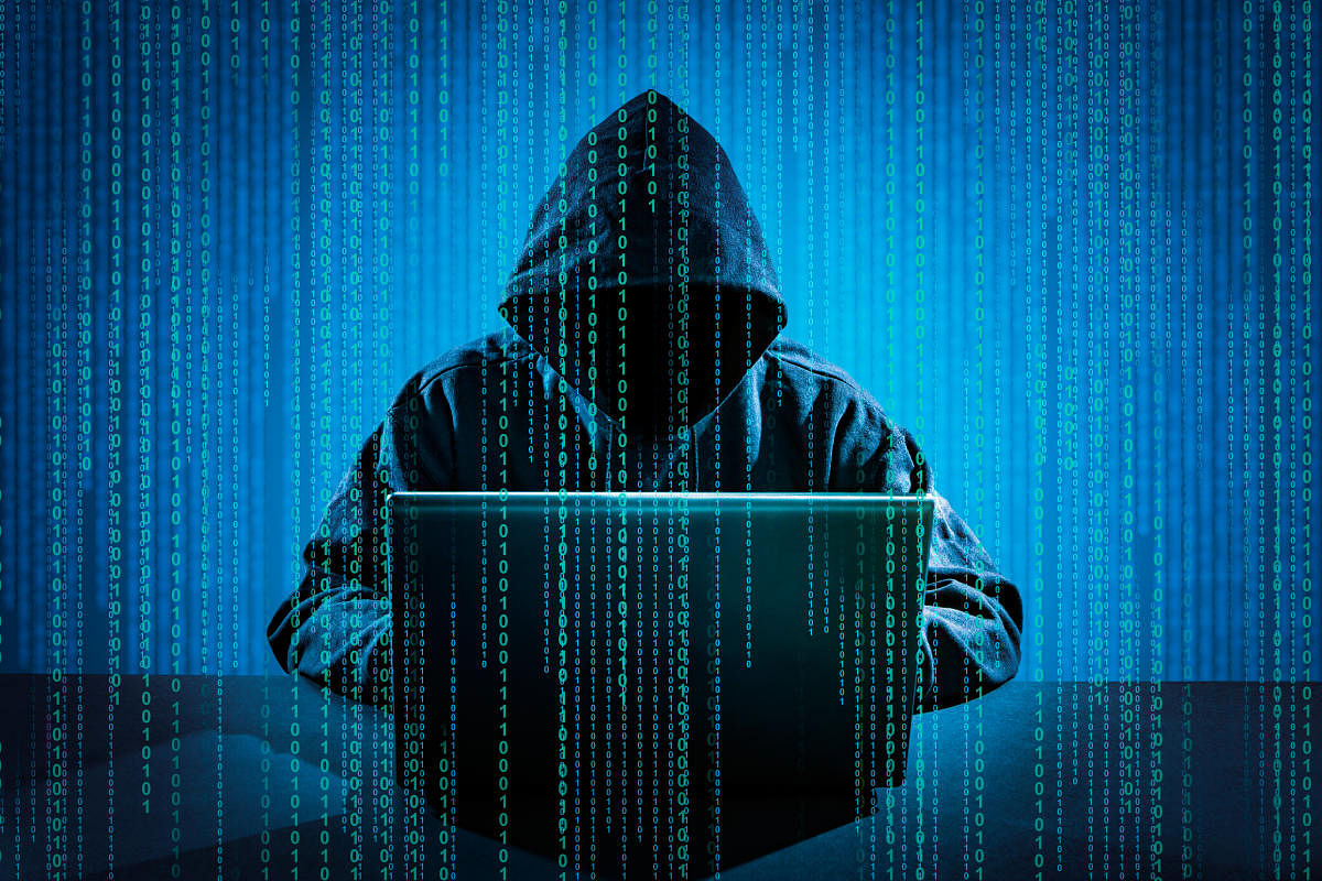 Hacker using laptop. Hacking the Internet.Hacker using laptop. Hacking the Internet.