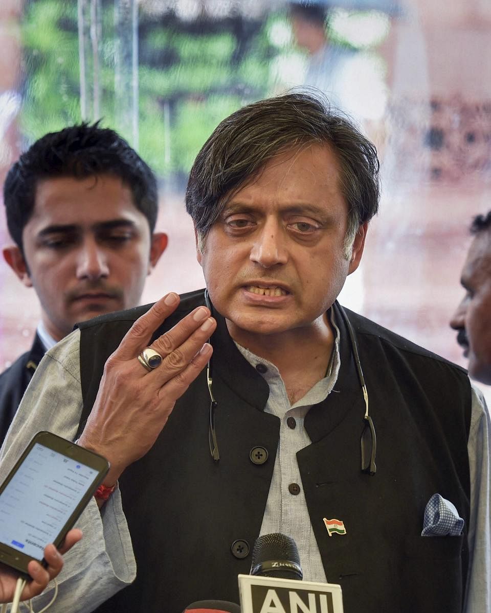 New Delhi: Congress leader Shashi Tharoor addresses the media after attending the first day of the Monsoon Session of Parliament, in New Delhi on Wednesday, July 18, 2018. (PTI Photo/Kamal Singh) (PTI7_18_2018_000086B)