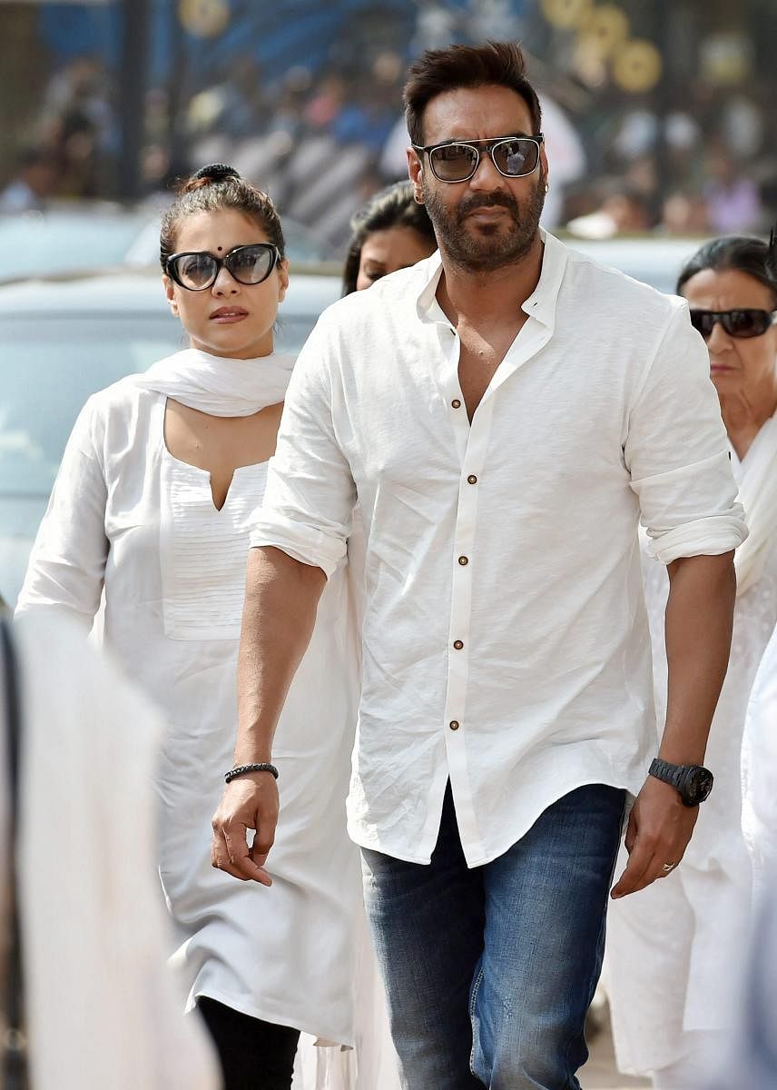 Mumbai: Actor Ajay Devgan with wife Kajol arrive to attend the condolence gathering following the demise of actress Sridevi in Mumbai on Wednesday. PTI Photo by Mitesh Bhuvad(PTI2_28_2018_000028B)