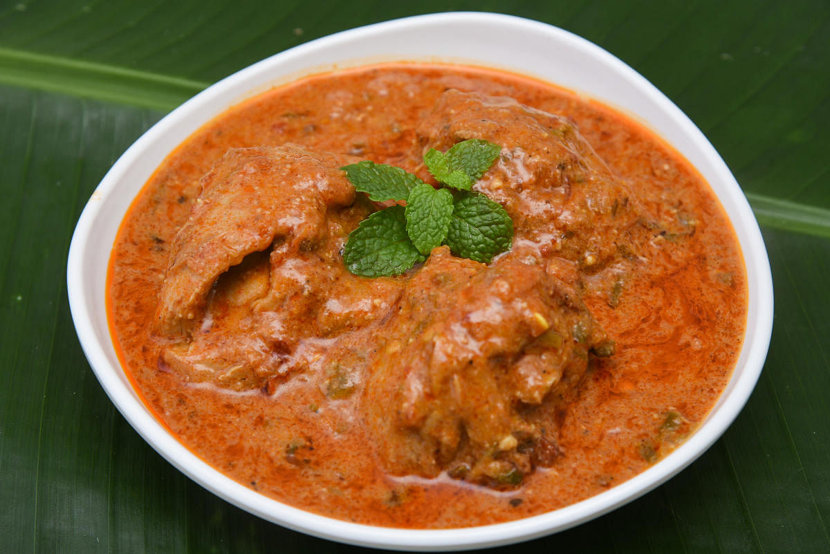 Butter chicken curry/tikka masala/Korma, hot and spicy with gravy Delhi, North India. Non-vegetarian food prepared using Indian spices/masala. dish chapati/roti/naan/paratha/paranthaFood , Chicken curry