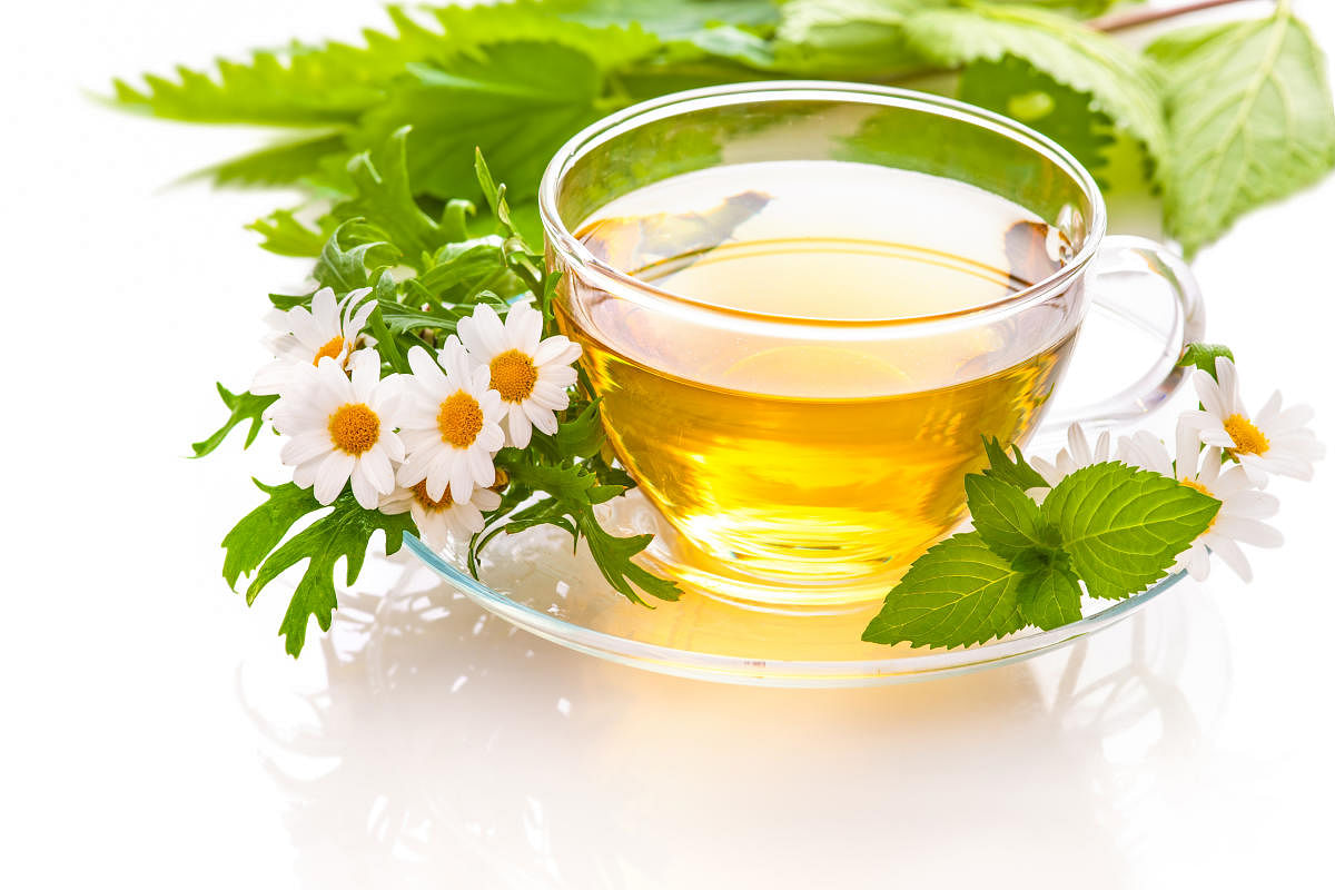 Herbal tea with chamomile and fresh mint leavesHerbal tea