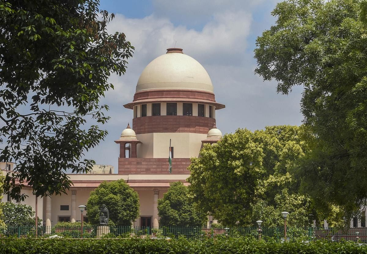 New Delhi: Indian national flag flies at half-mast at Supreme Court during the seven-day state mourning on demise of former President Pranab Mukherjee, in New Delhi, Tuesday, Sep. 1, 2020. (PTI Photo/Shahbaz Khan) (PTI01-09-2020_000068B)